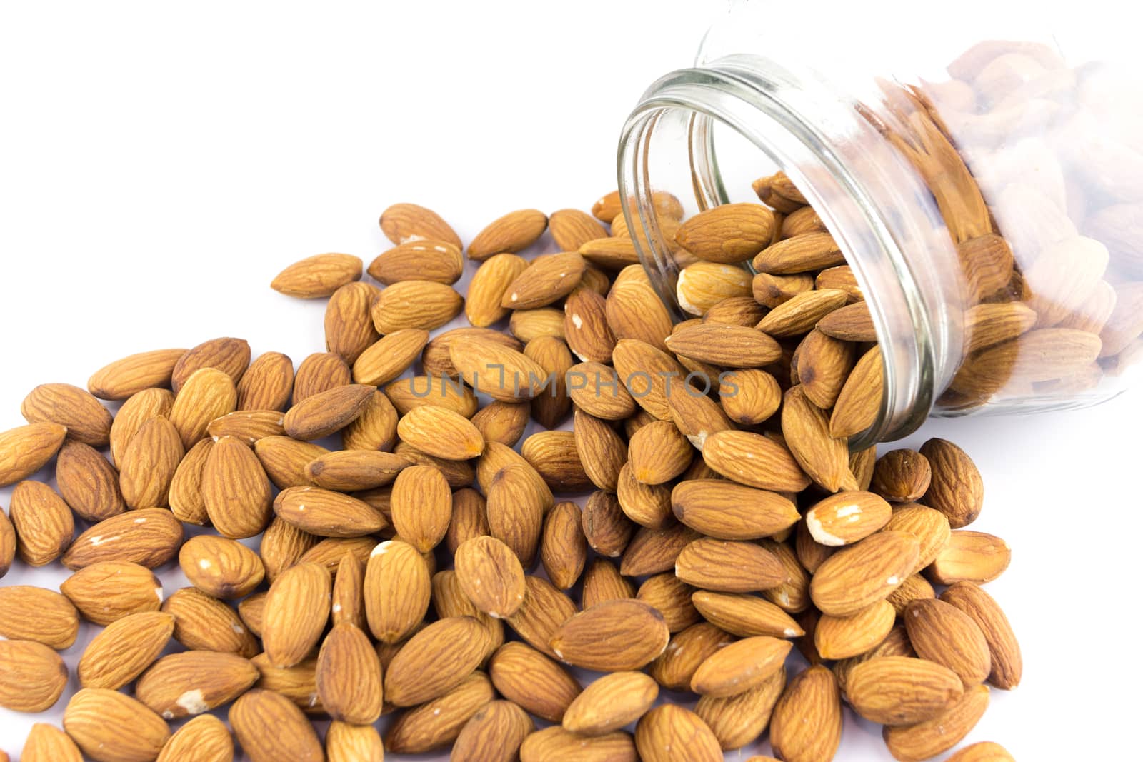 almonds nuts isolated on white background by wyoosumran