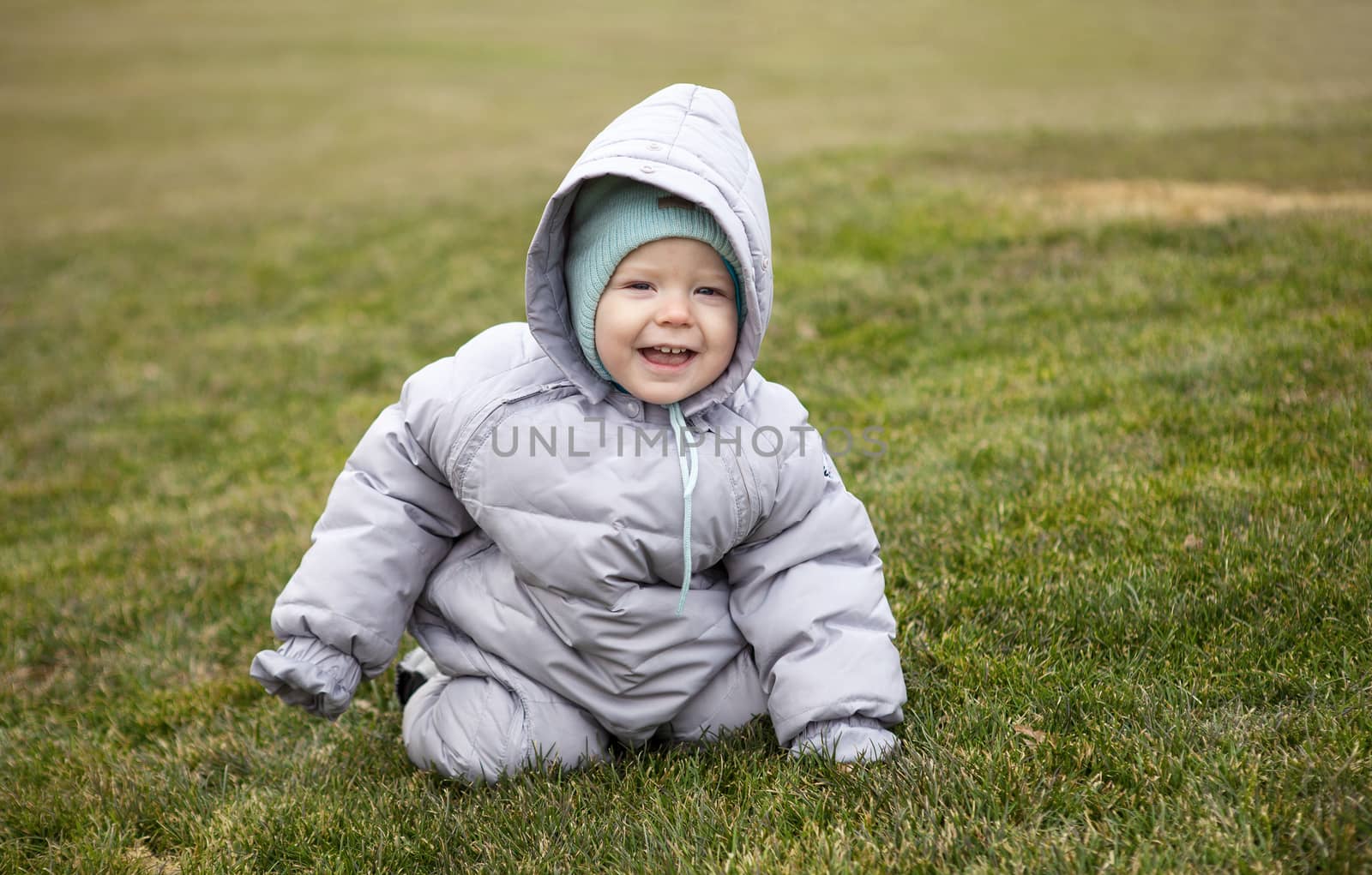 Portrait of a cute little boy in a spring park