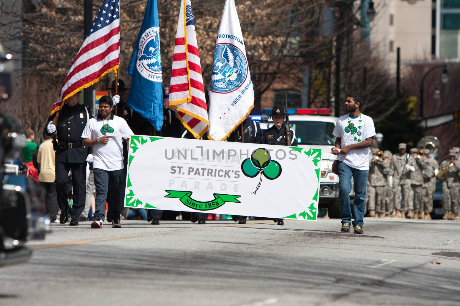 Atlanta, GA - March 15, 2014:  Two men carry a banner that starts the annual Atlanta St. Patrick's parade.