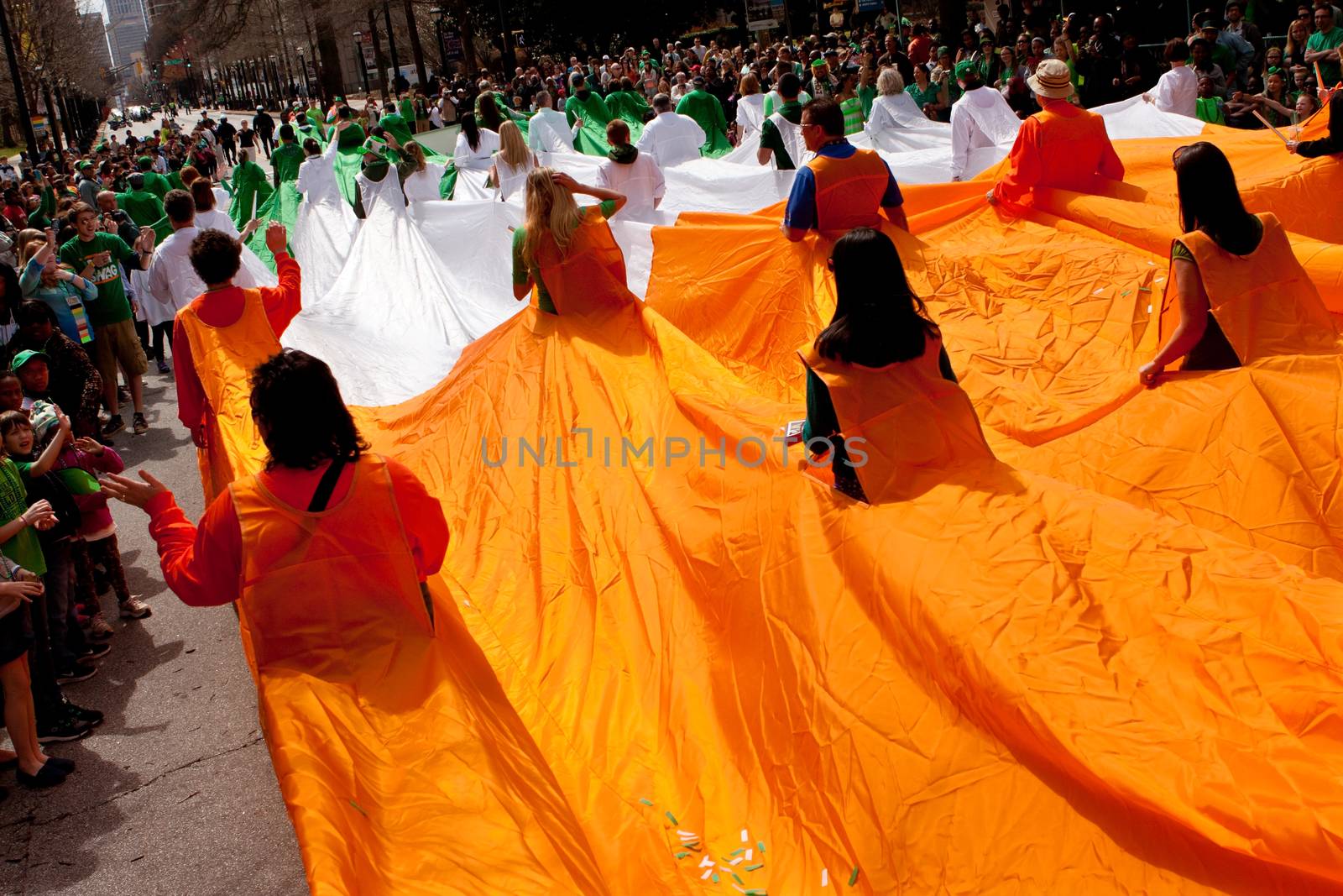 Atlanta, GA, USA - March 15, 2014:  People form a human flag of Ireland at the St. Patrick's parade on Peachtree Street.