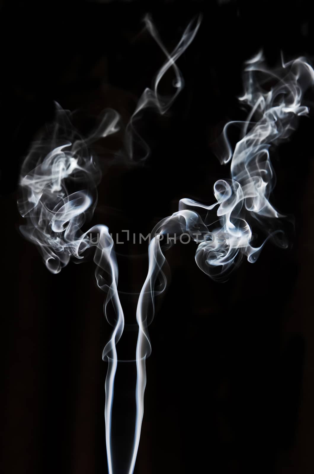 textured of incense smoke on dark background