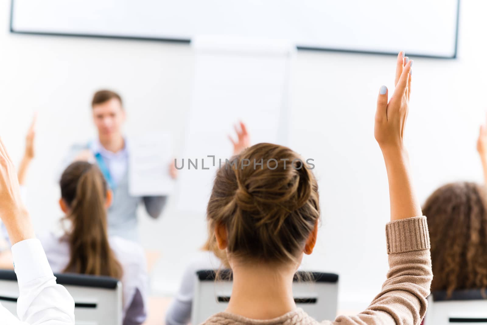 female hand raised in class by adam121