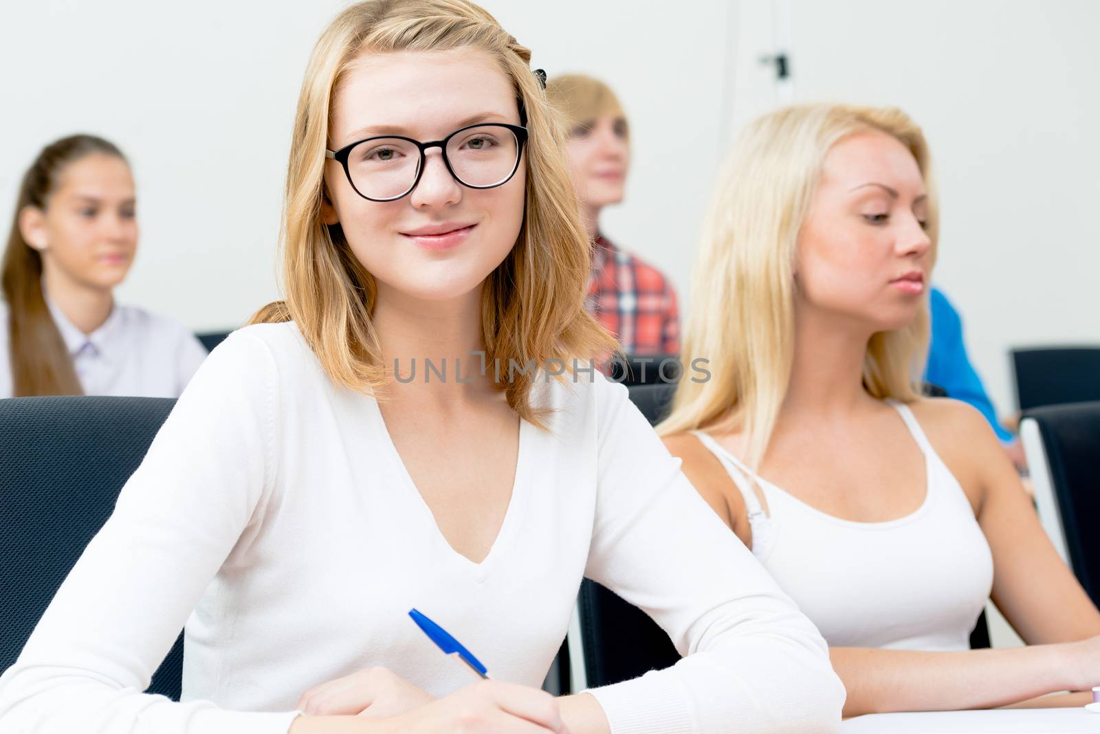 image of a young female students in the classroom, teaching at the University of