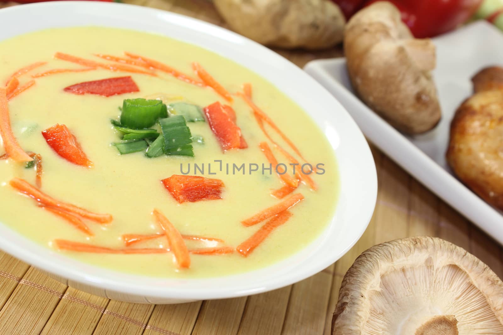Asian Curry Soup with chicken, spring onions and carrots