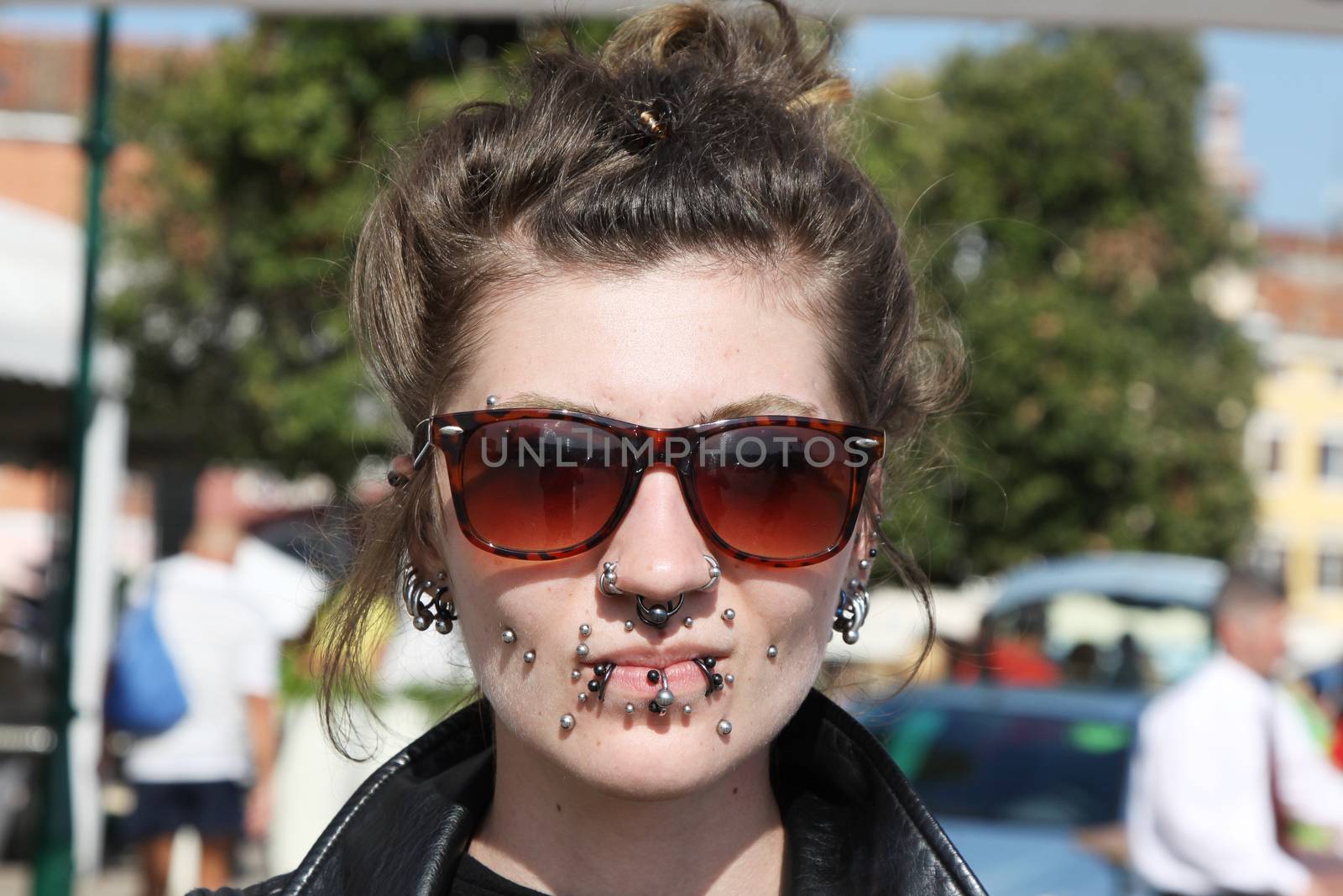 ROVINJ, CROATIA - SEPTEMBER 14: Unidentified girl with a lot of piercing on the street of Rovinj during the Unknown Festival on September 14, 2013. The annual Unknown Festival is from September 10 to September 14, 2013.