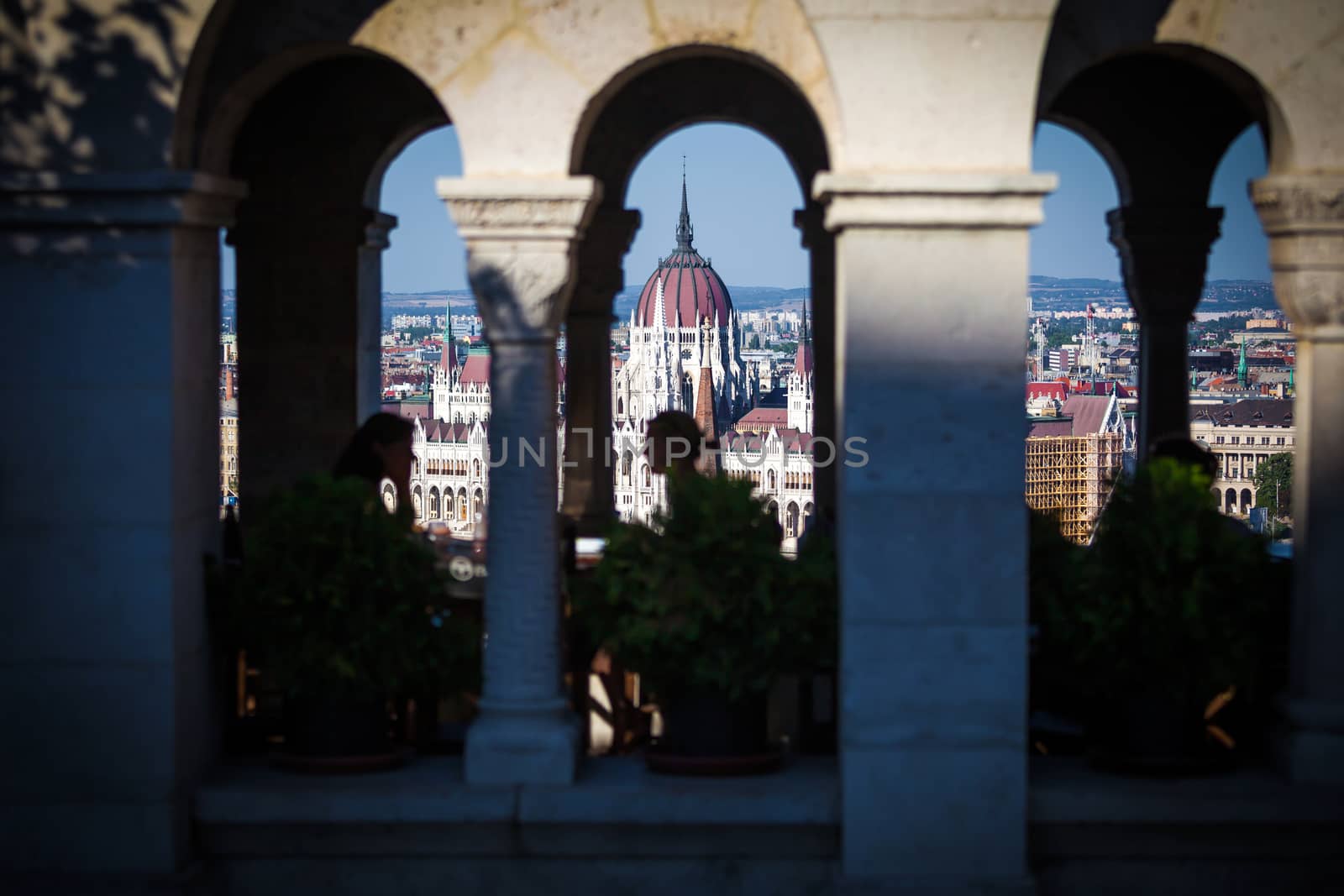 View of Hungarian Parliament Building with customers at Buda Castle restaurant, Budapest, Hungary