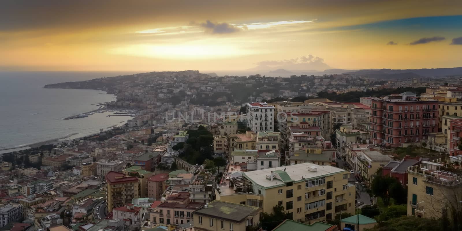 View of Naples seaside at dusk, with Posillipo, Mergellina and Riviera di Chiaia.