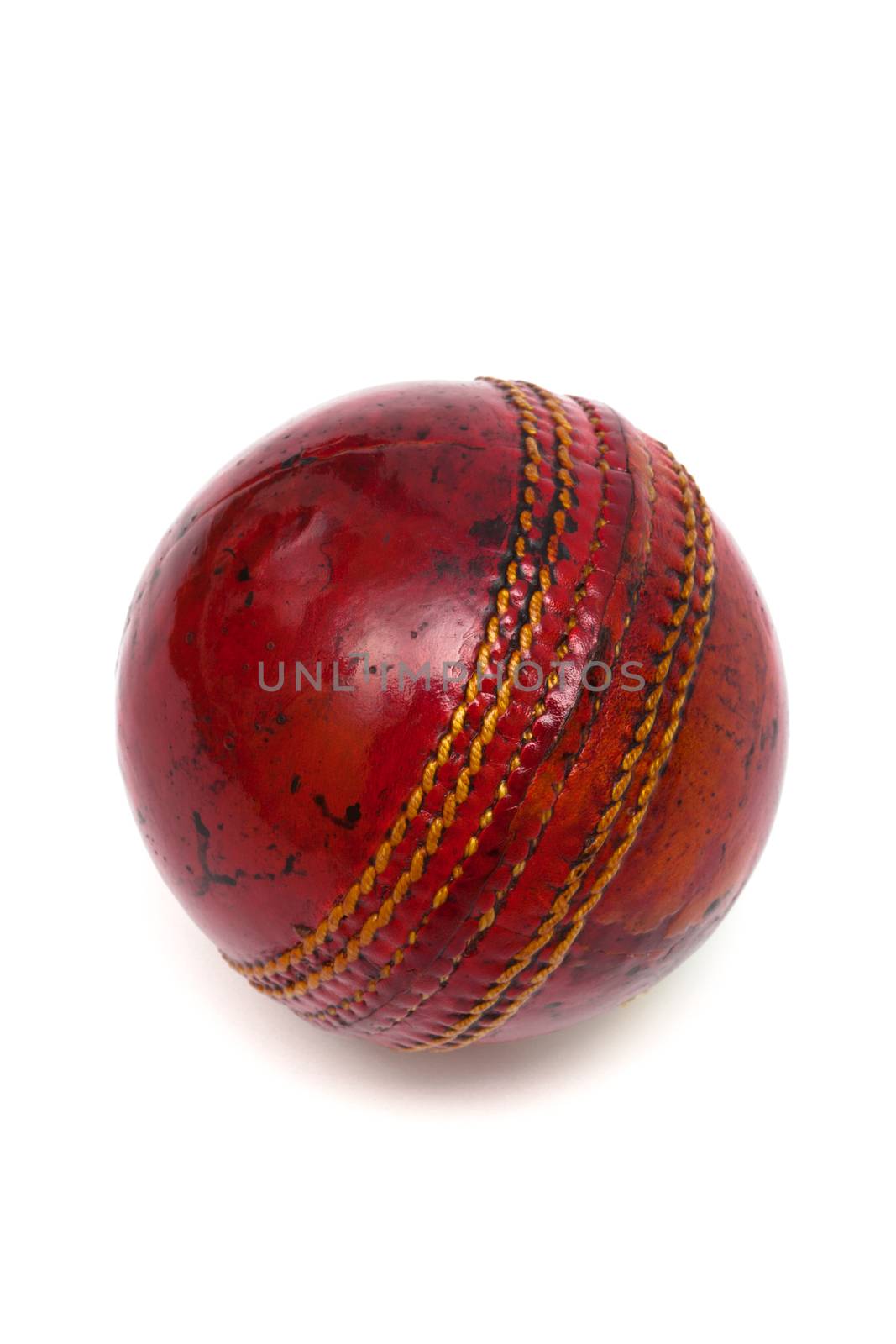 red ball cricket on a white background
