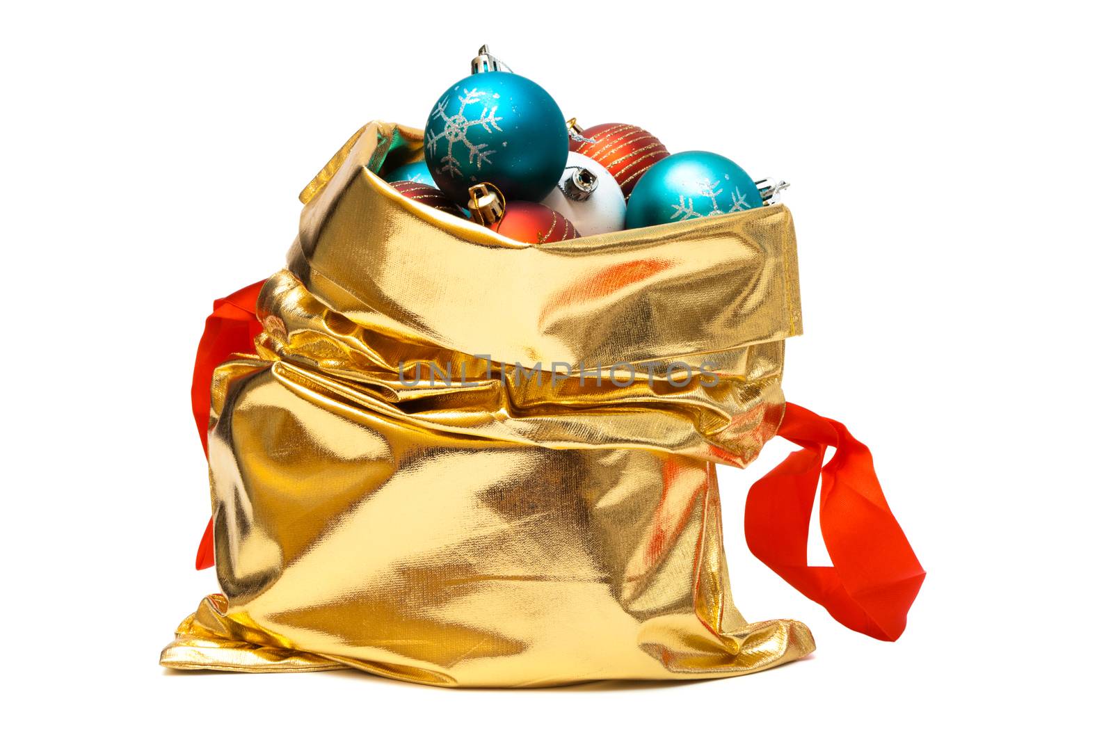 gold bag with Christmas balls on white background