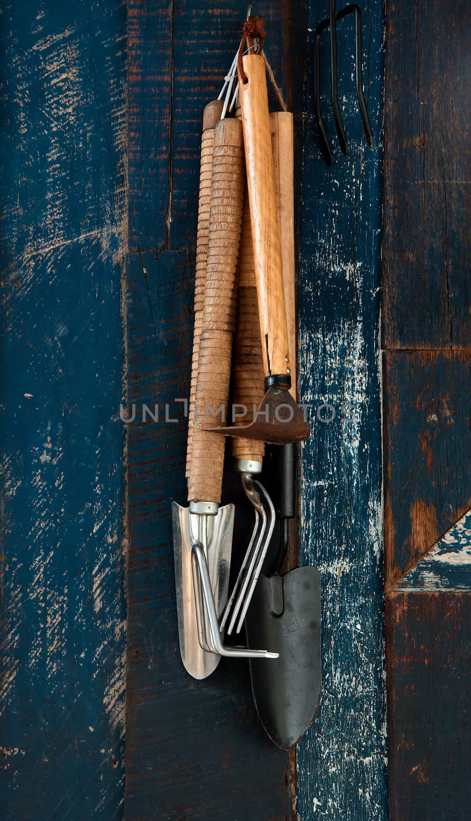Gardening tools hanging on the wall
