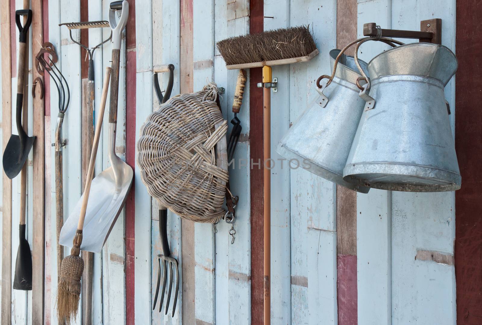 Gardening tools hanging on the wall