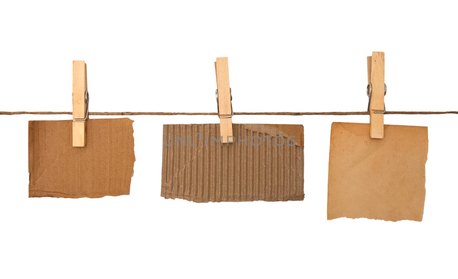close up of a notes and a clothes pegs on white background