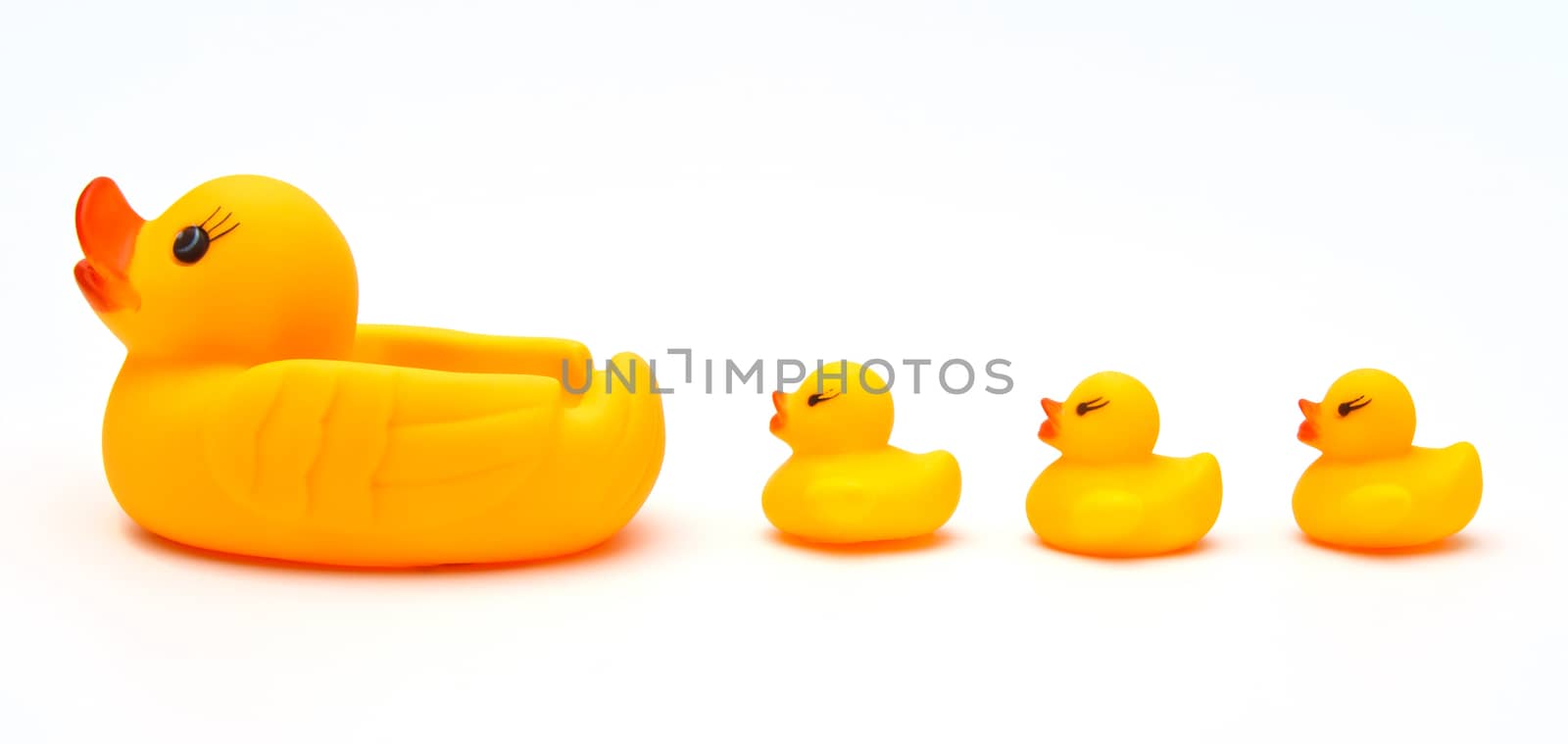 Cute yellow rubber duck isolated over white background