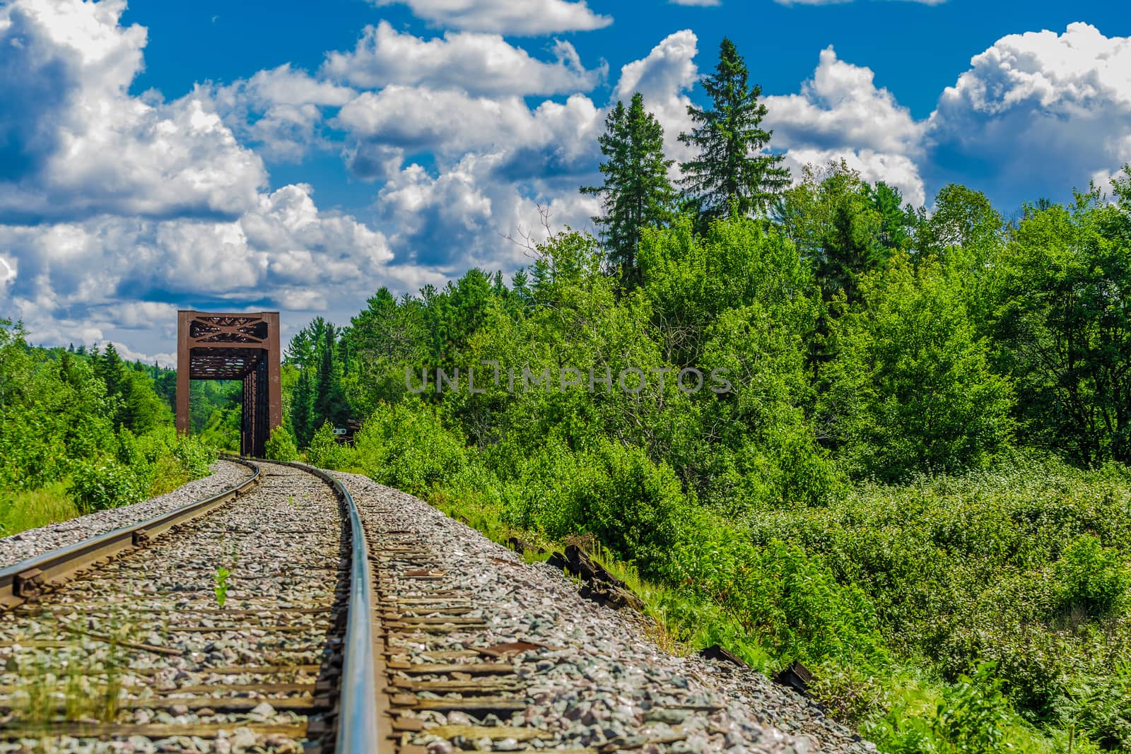 An amazing view of a really long railway on a sunny day. Canada.