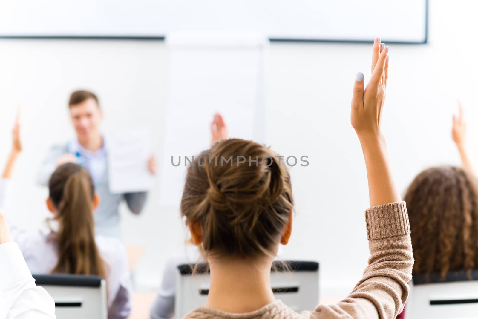 female hand raised in class by adam121