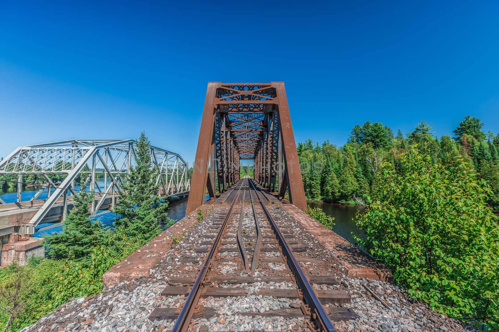 An amazing view of a really long railway on a sunny day. Canada.