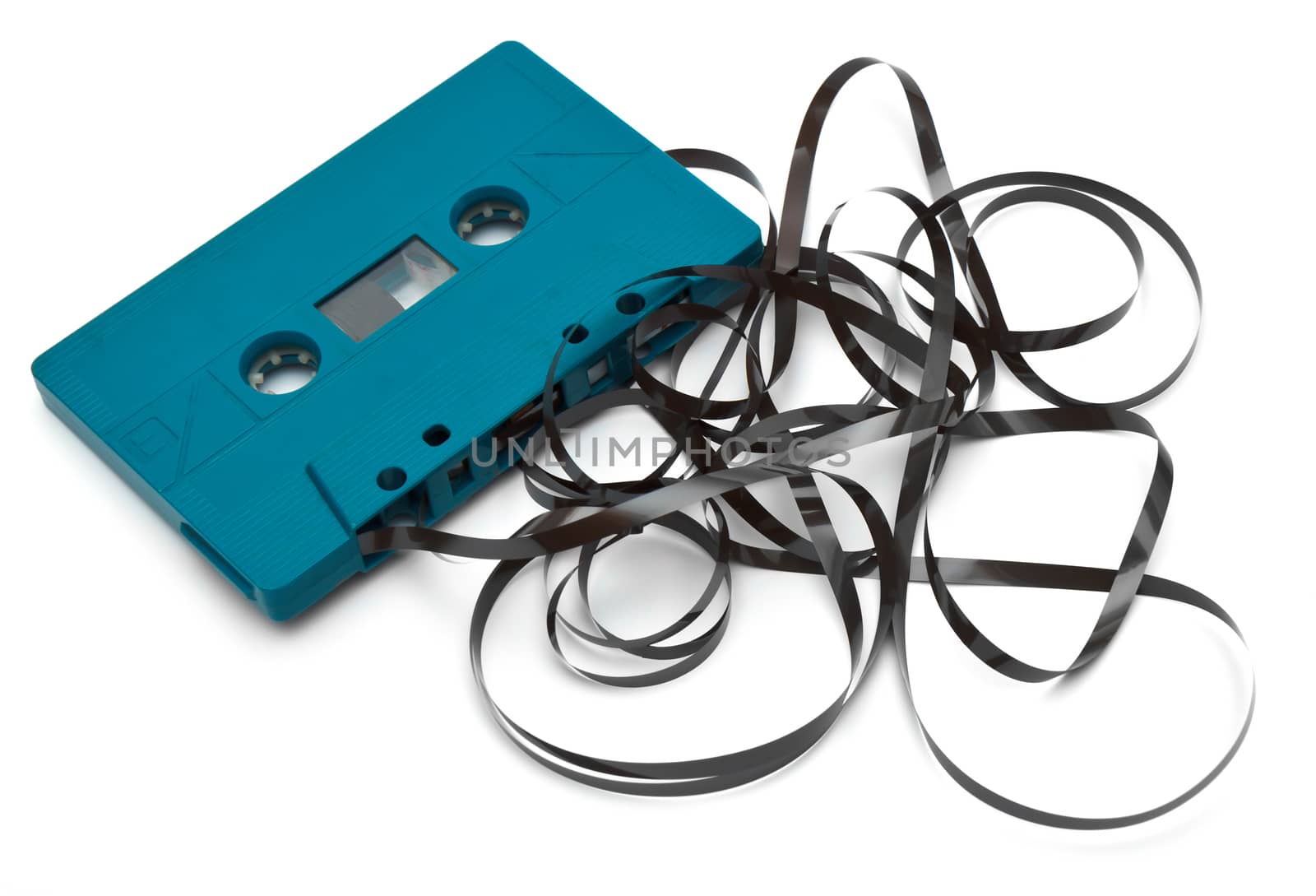 Old broken cassette isolated on white