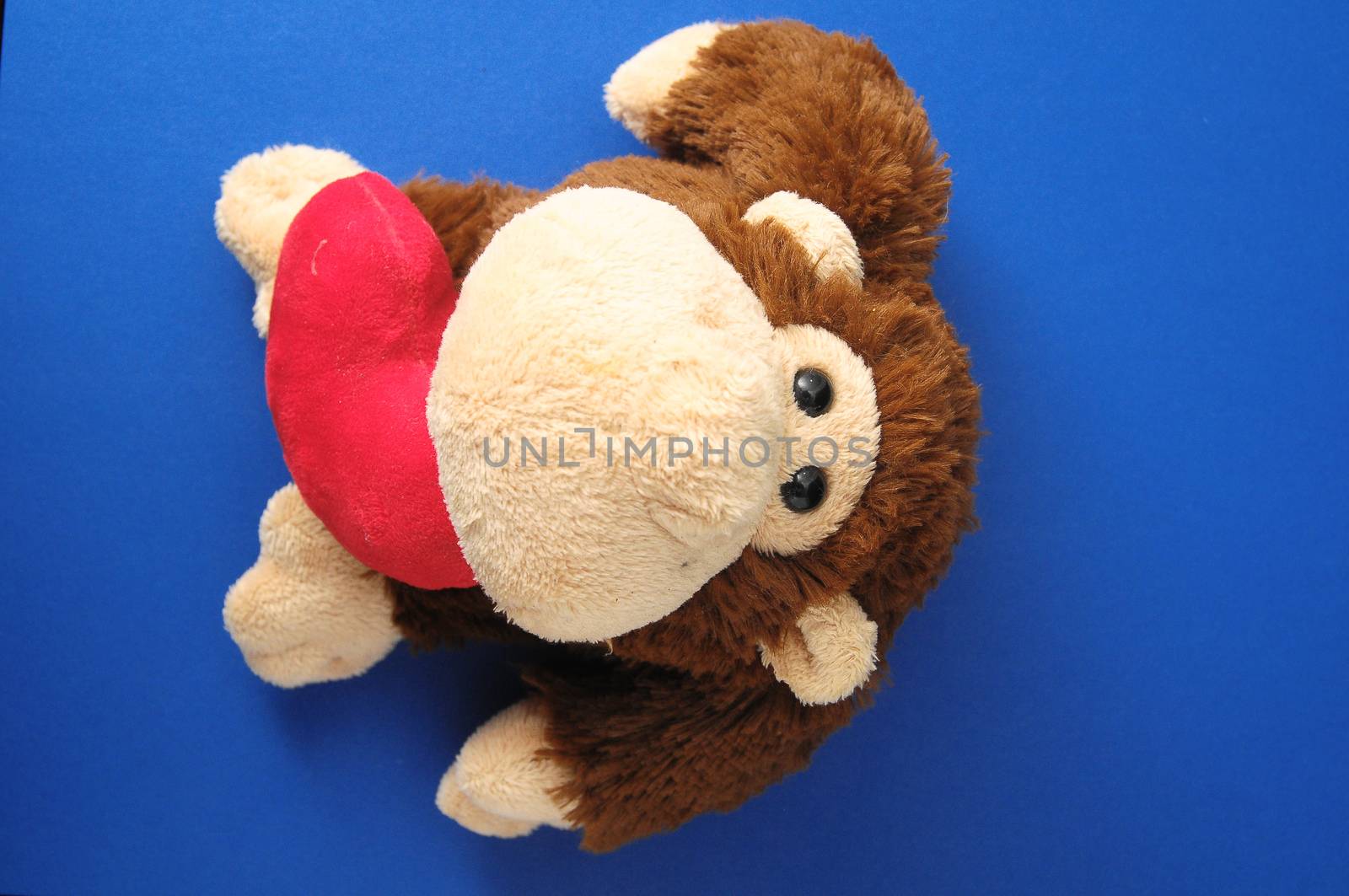 Funny Brown Monkey Peluche and a Red Heart