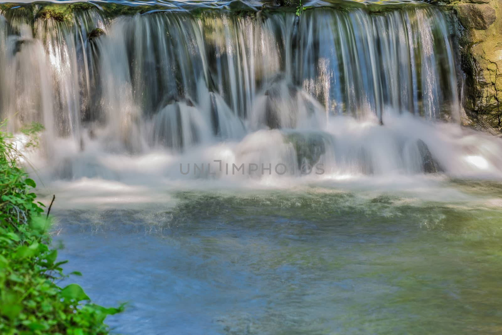 An amazingly clear waterfall in the wild nature in the forests of Ontario, Canada.