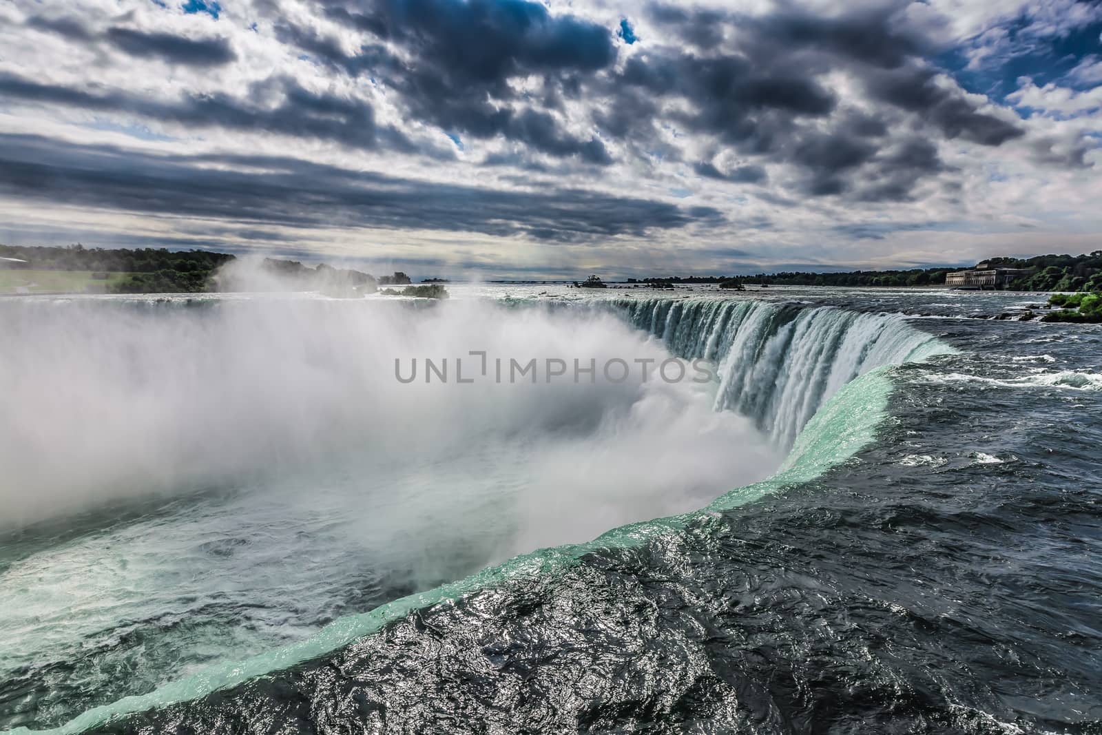 The view of the Niagra falls from the canadian side on a beautiful sunny day in Ontario, Canada.