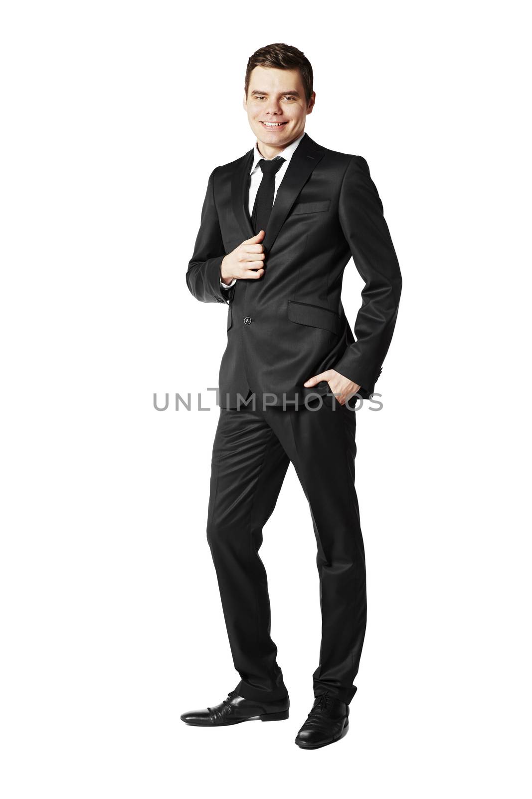 Young businessman against white background.