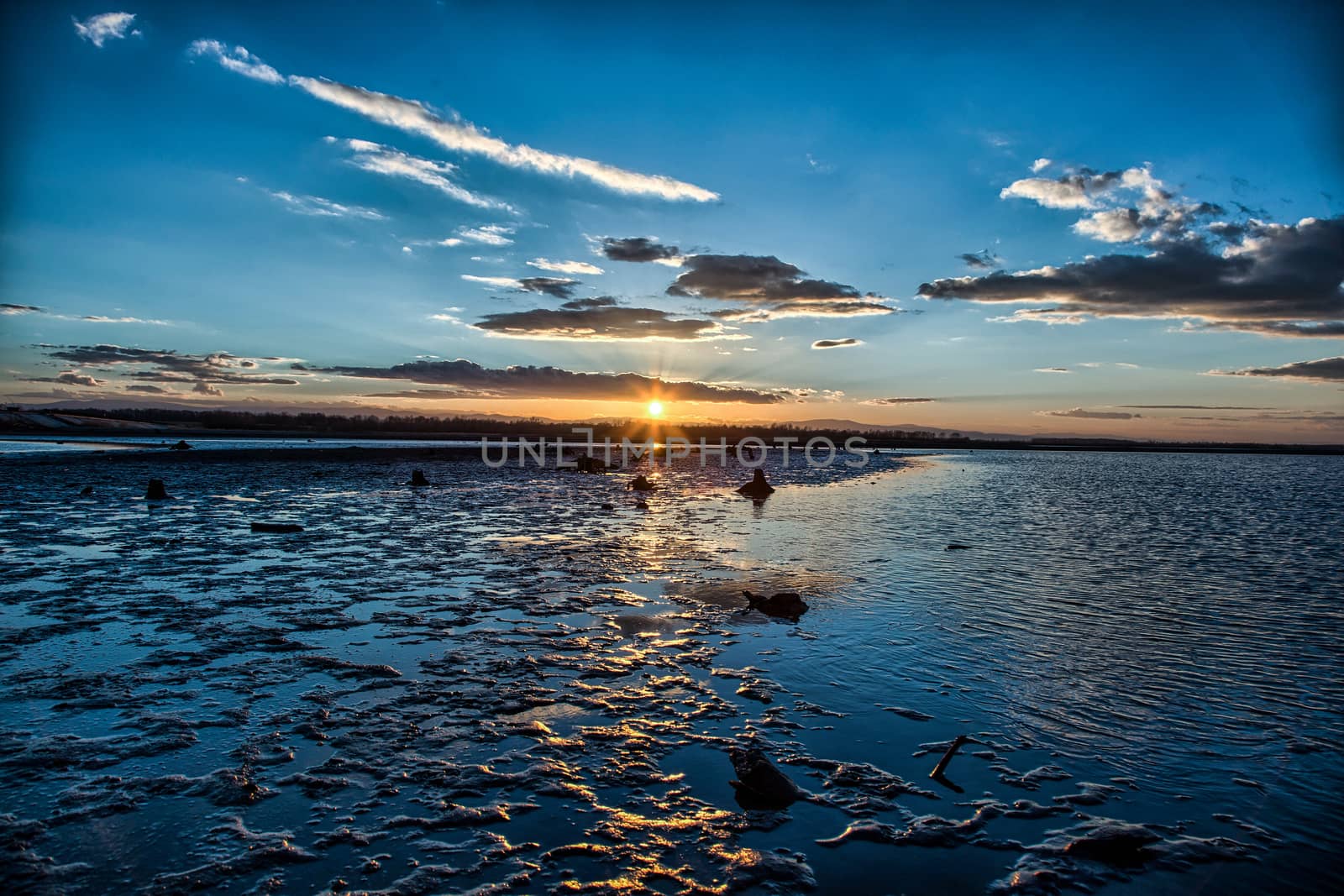 Mud and sand at the beach of the lake