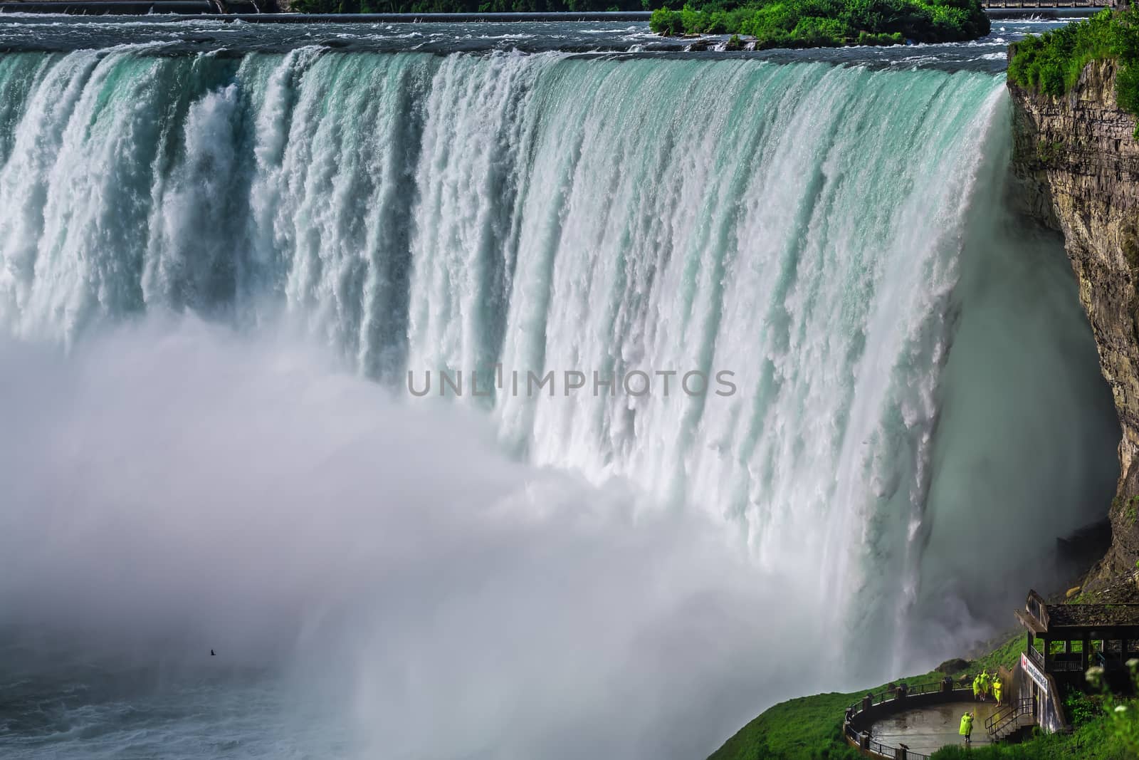 The view of the Niagra falls from the canadian side on a beautiful sunny day in Ontario, Canada.