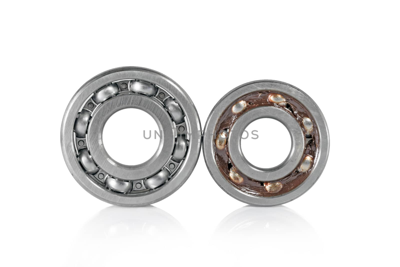 ball bearing smeared with grease bearings, isolated over white