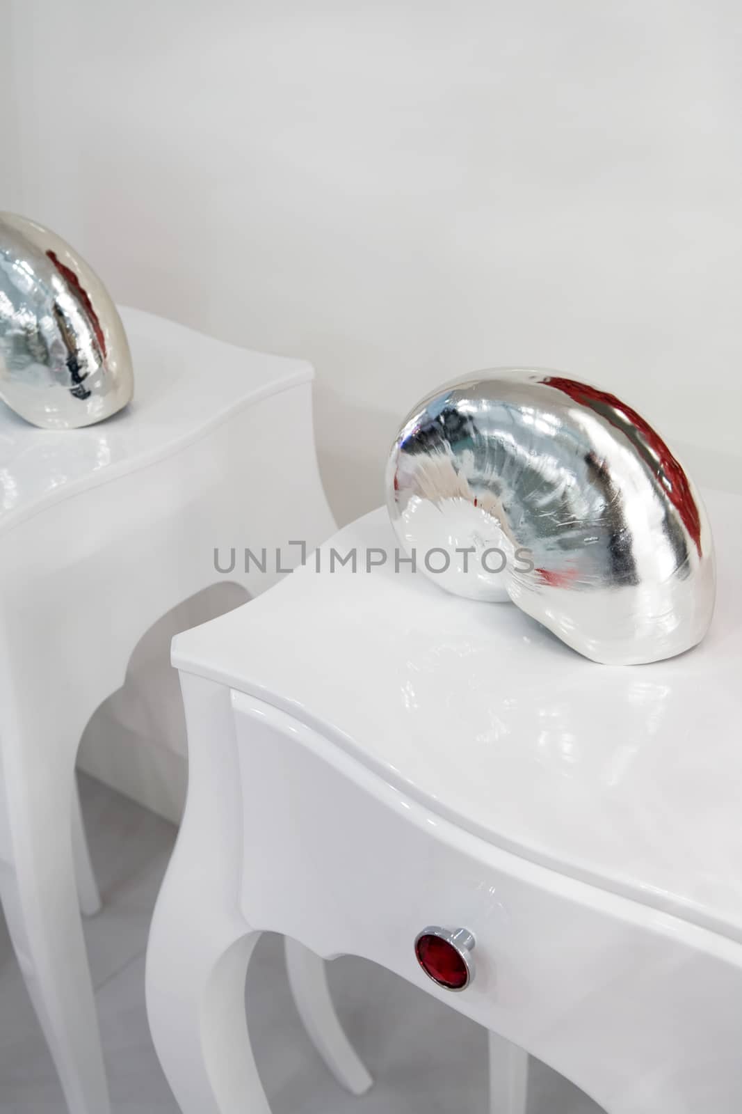 shell in white bedside table in a modern bedroom