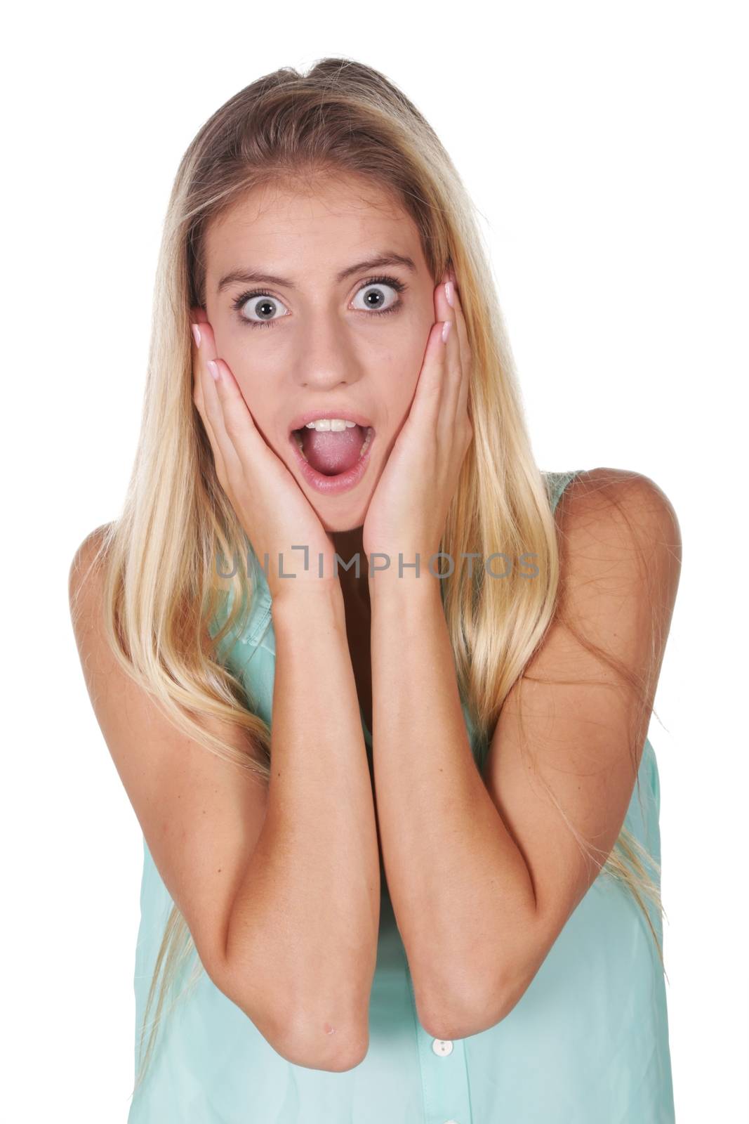 Pretty blond woman with mouth open and wide open eyes in shock