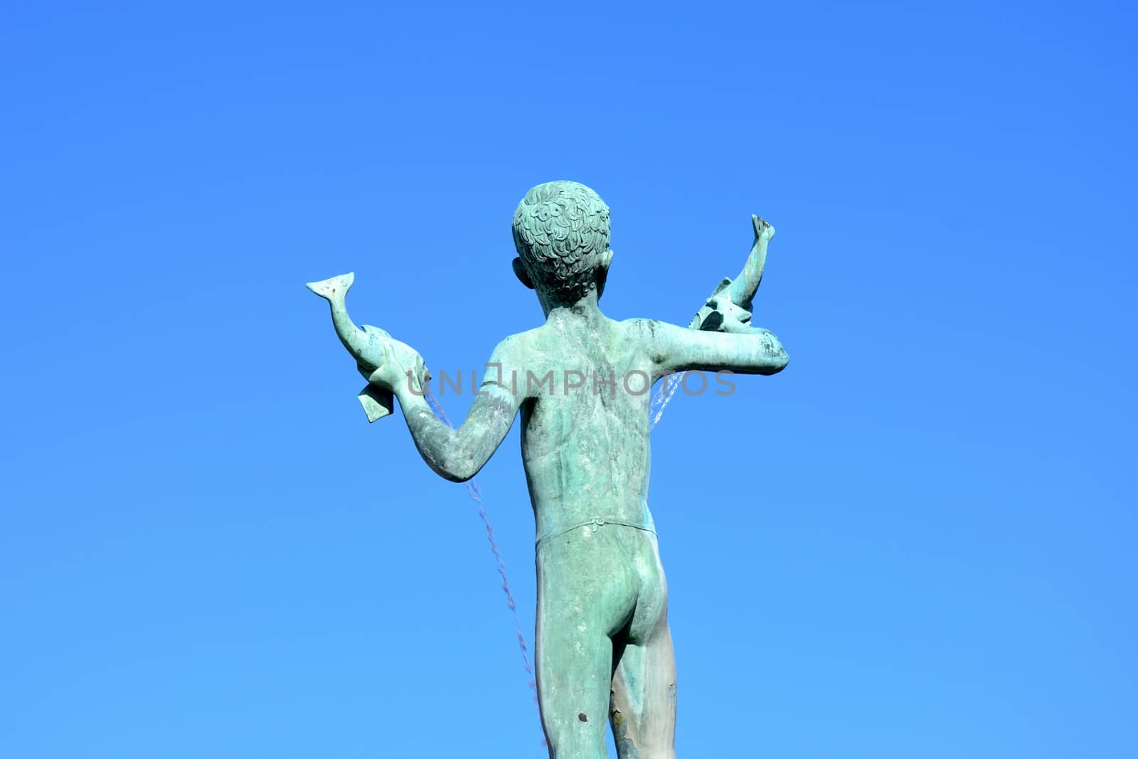 Statue of boy holding fish by pauws99