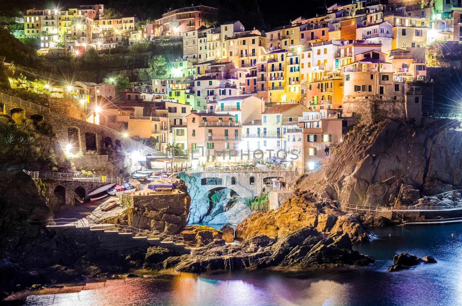 Scenic night view of colorful village Manarola in Cinque Terre, Italy
