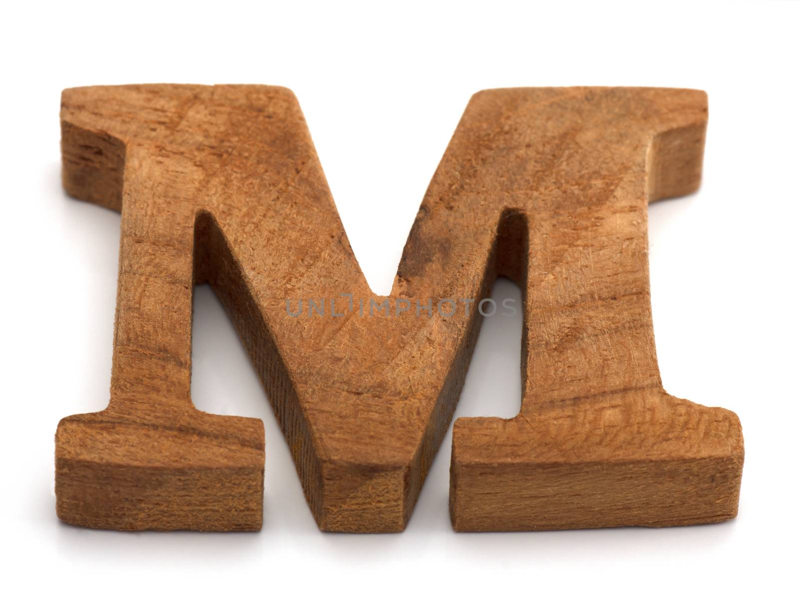 Alphabet made from wood on white