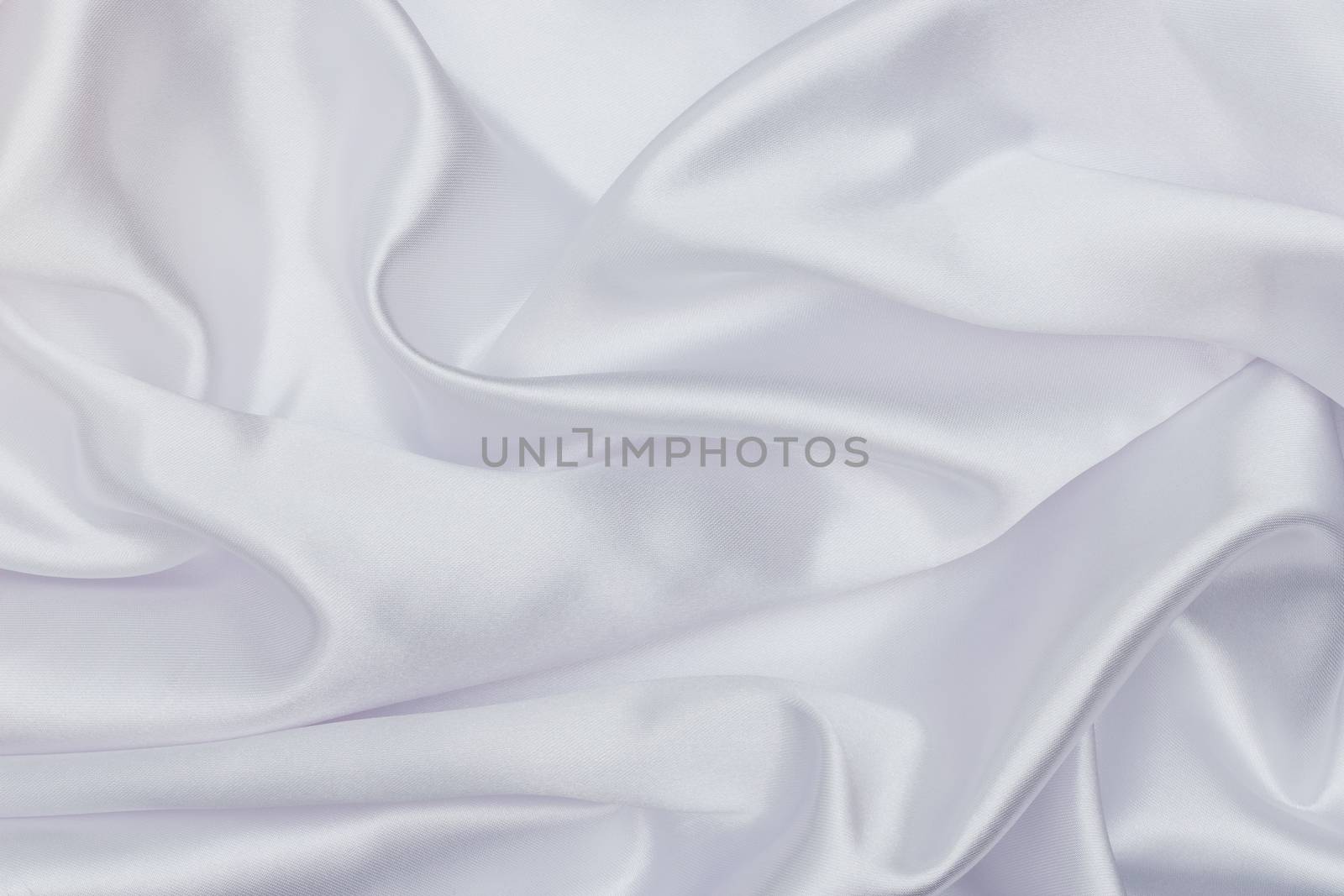 Closeup of white satin fabric as background