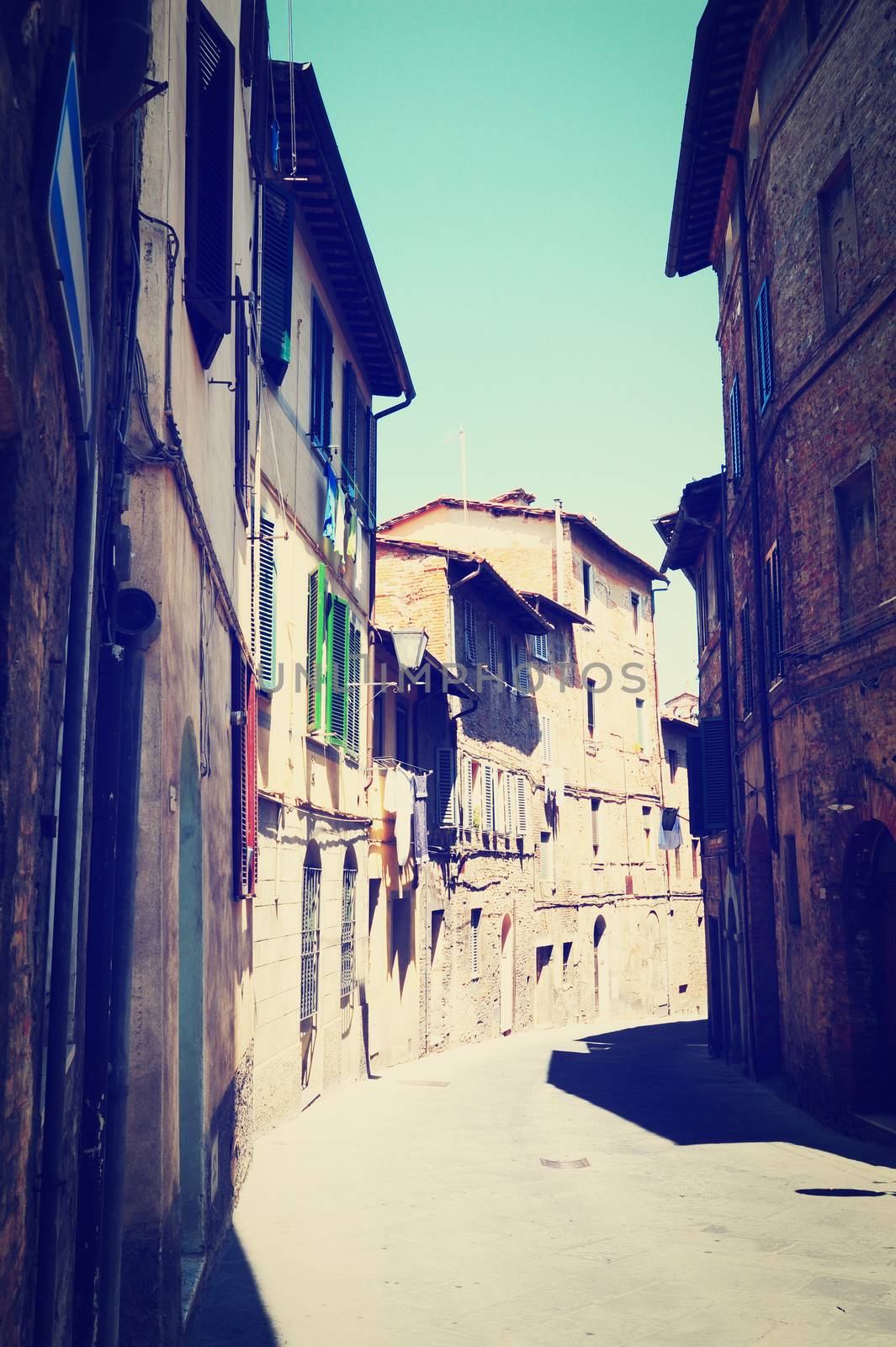 Narrow Alley with Old Buildings in Italian City of Siena, Instagram Effect