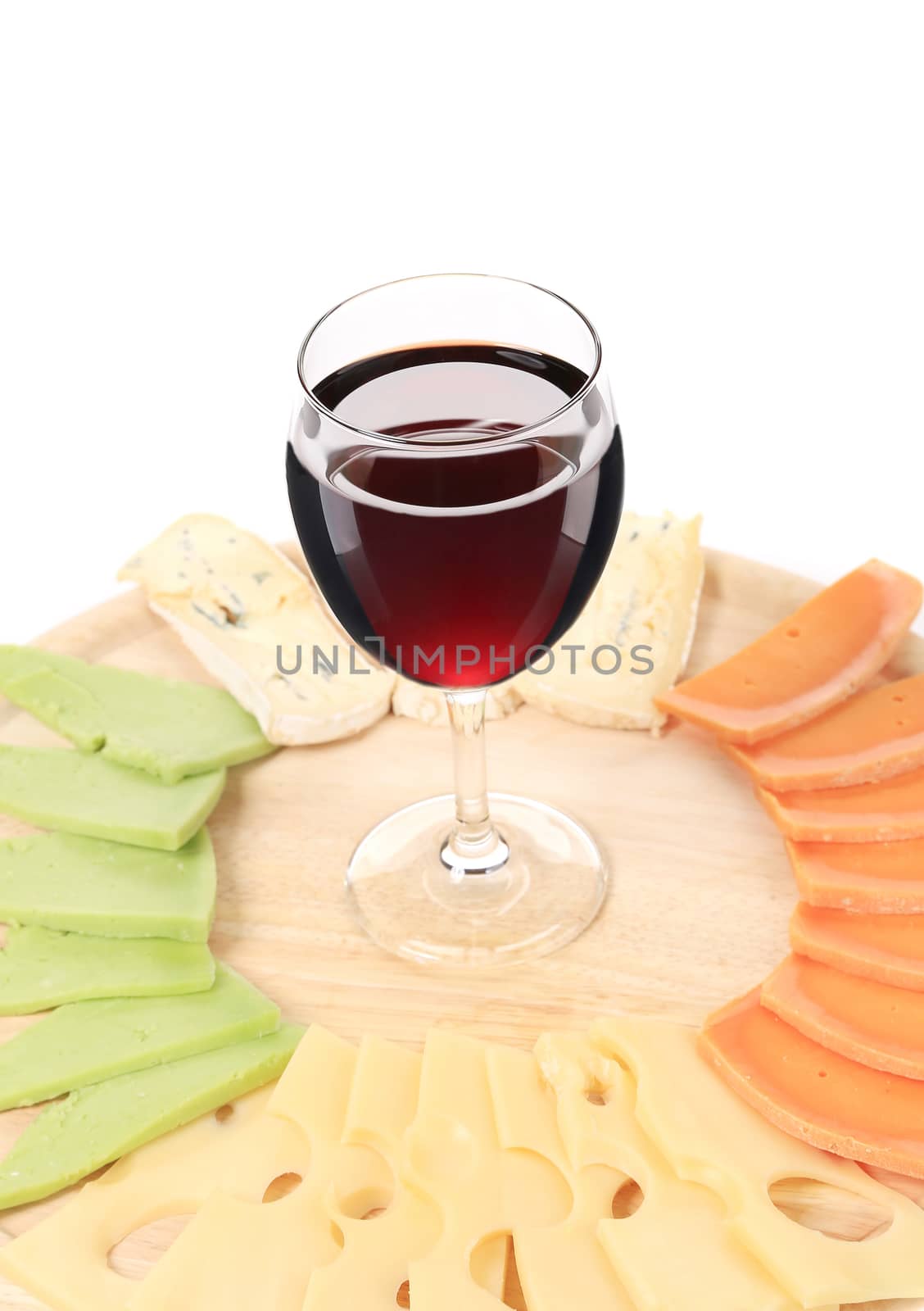 Cheese plate and glass of wine. Isolated on a white background.