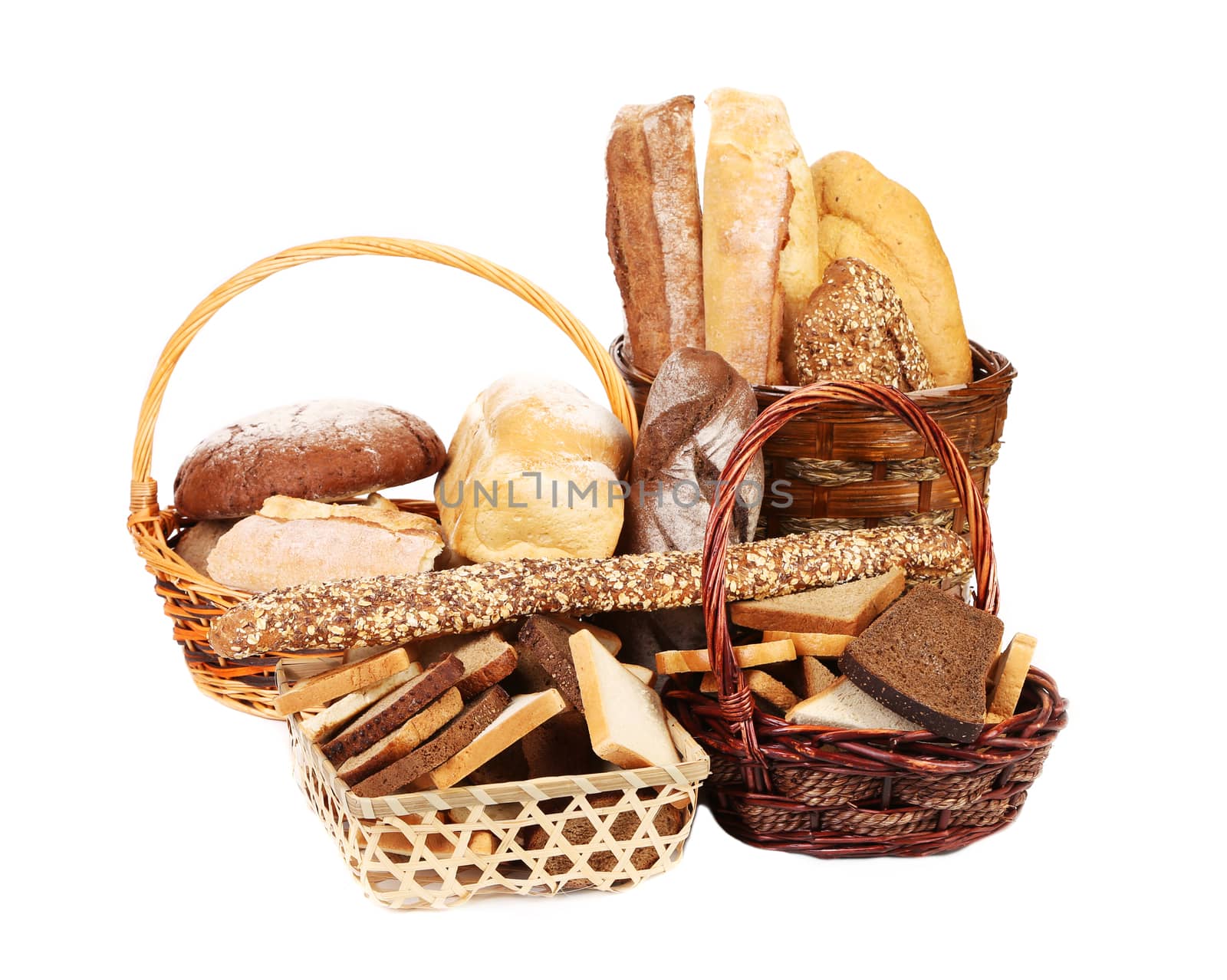 Fresh bread in wicker baskets. Isolated on a white background.