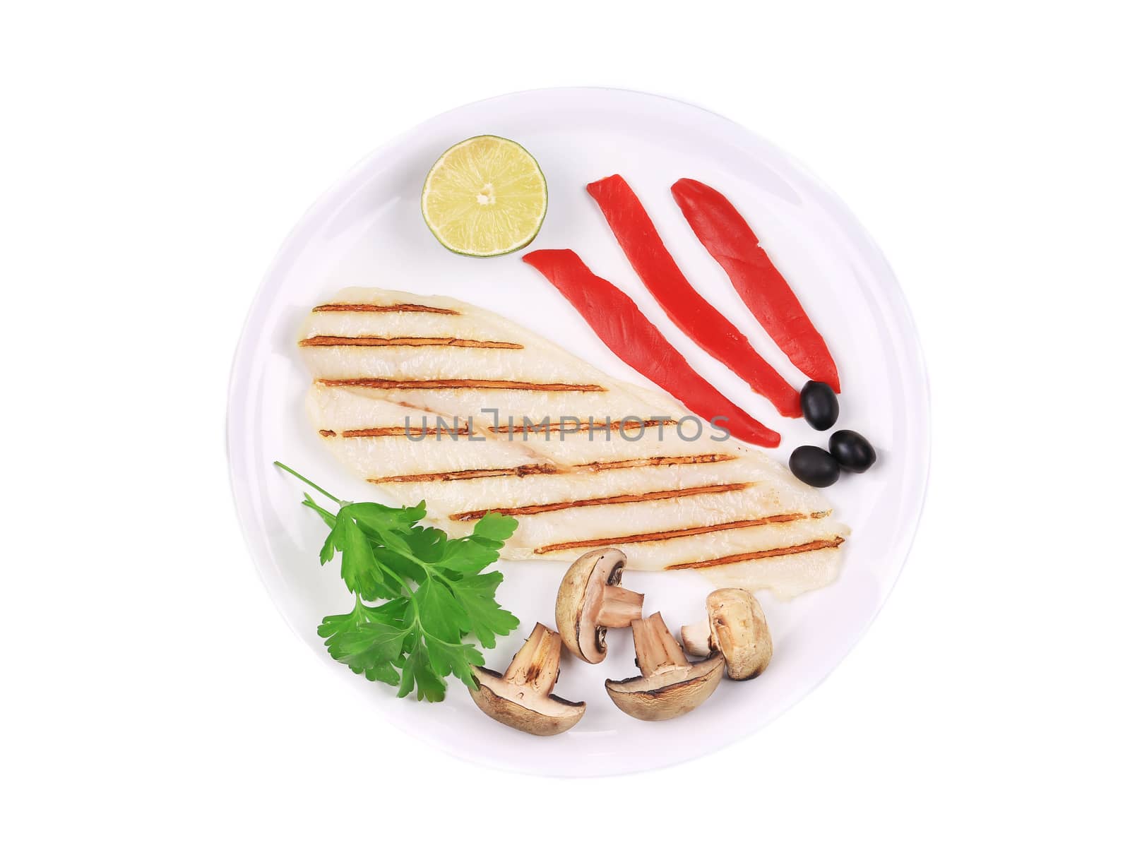 Grilled fish fillet with vegetables. Isolated on a white background.