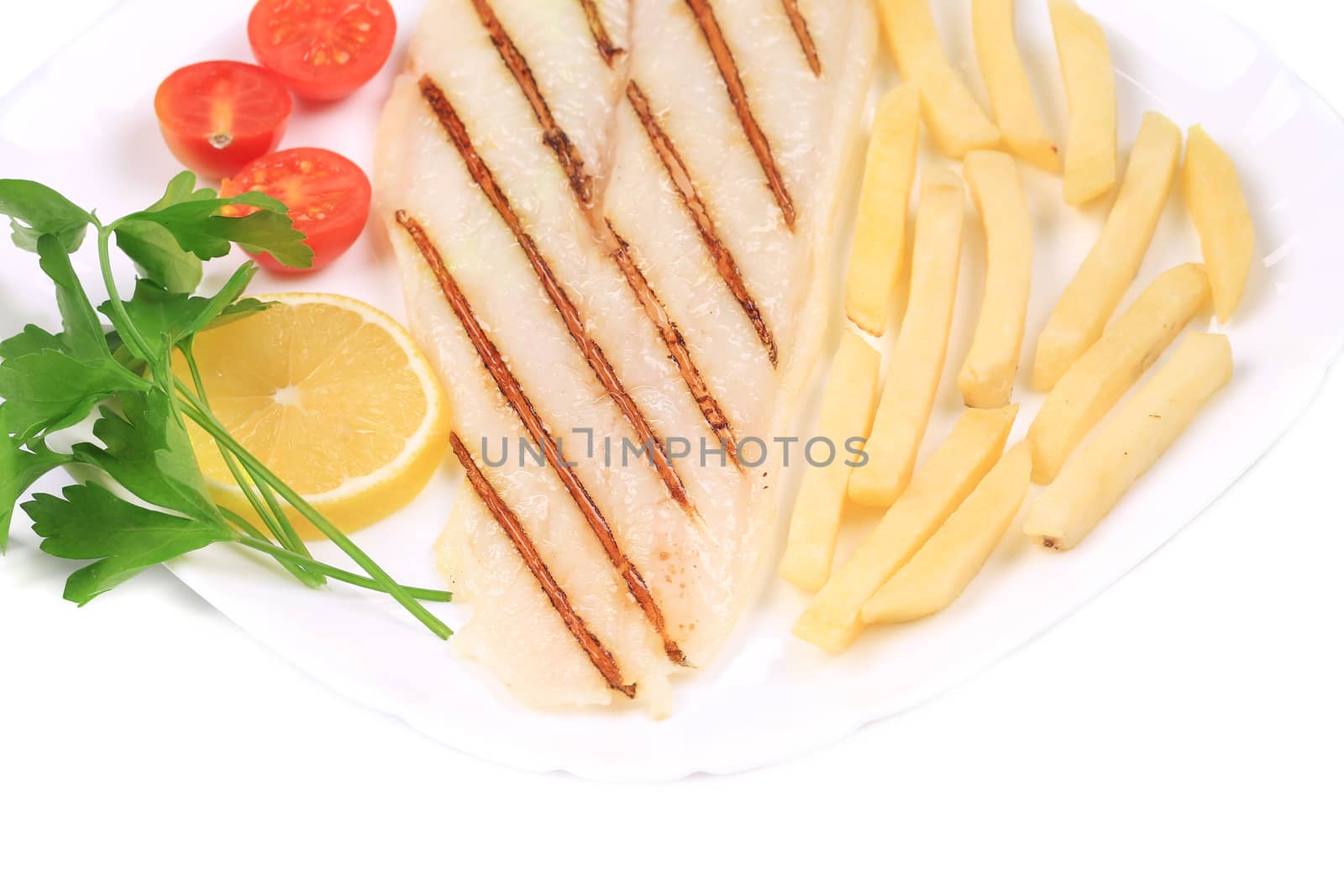 Grilled fish with french fries. Isolated on a white background.