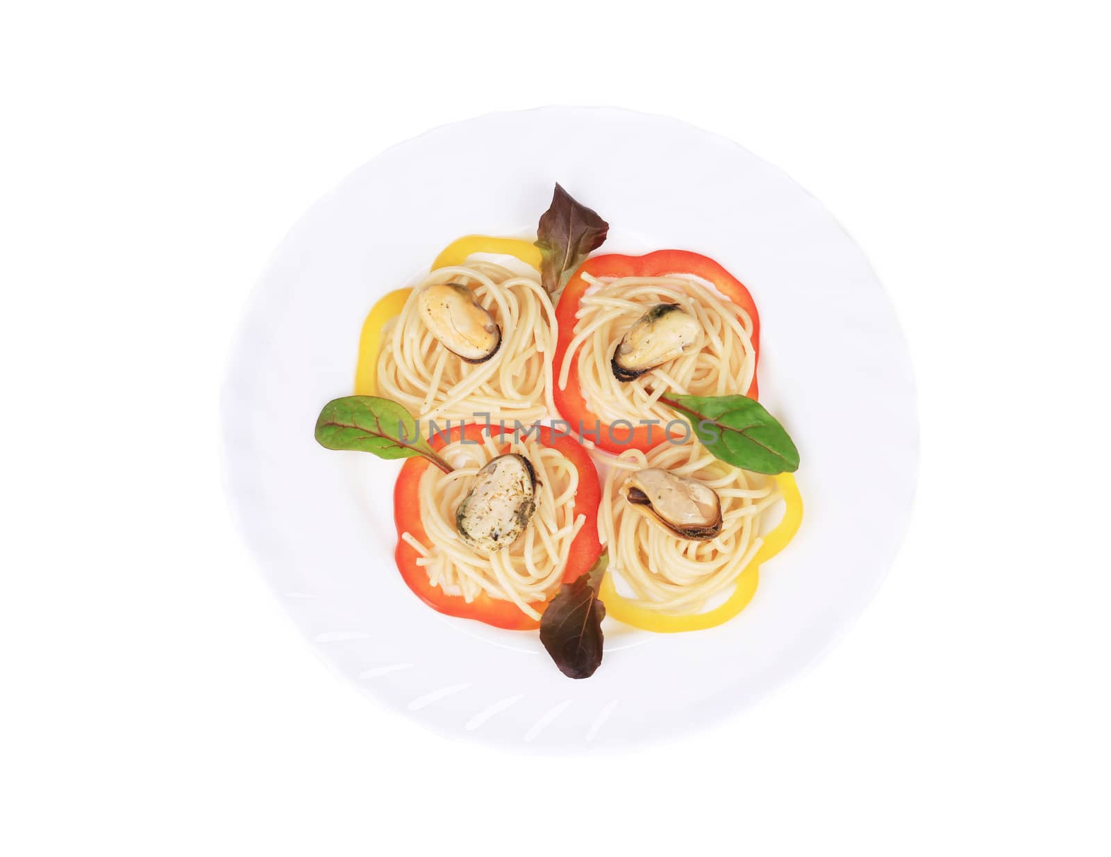 Pasta with mussels and basil. Isolated on a white background.