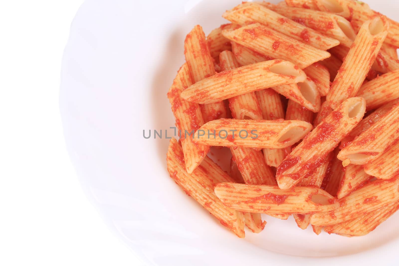 Pasta penne rigate with tomato sauce. Isolated on a white background.