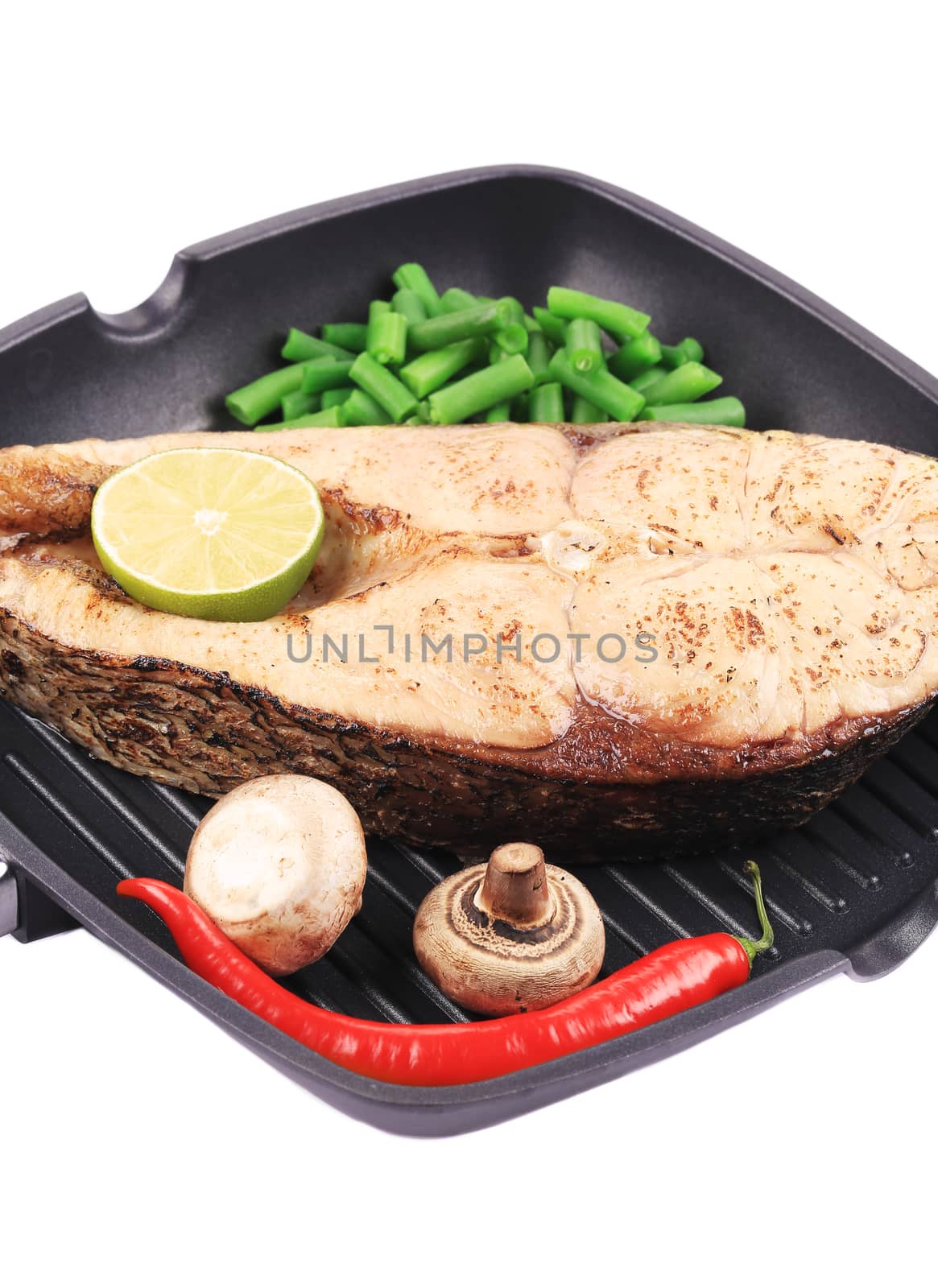 Grilled carp steak on pan. Isolated on a white background.