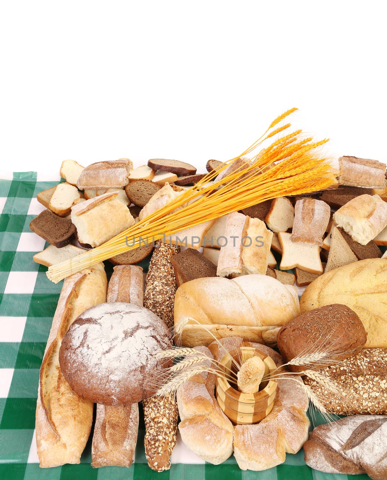 Breads on tablecloth. Isolated on a white background.