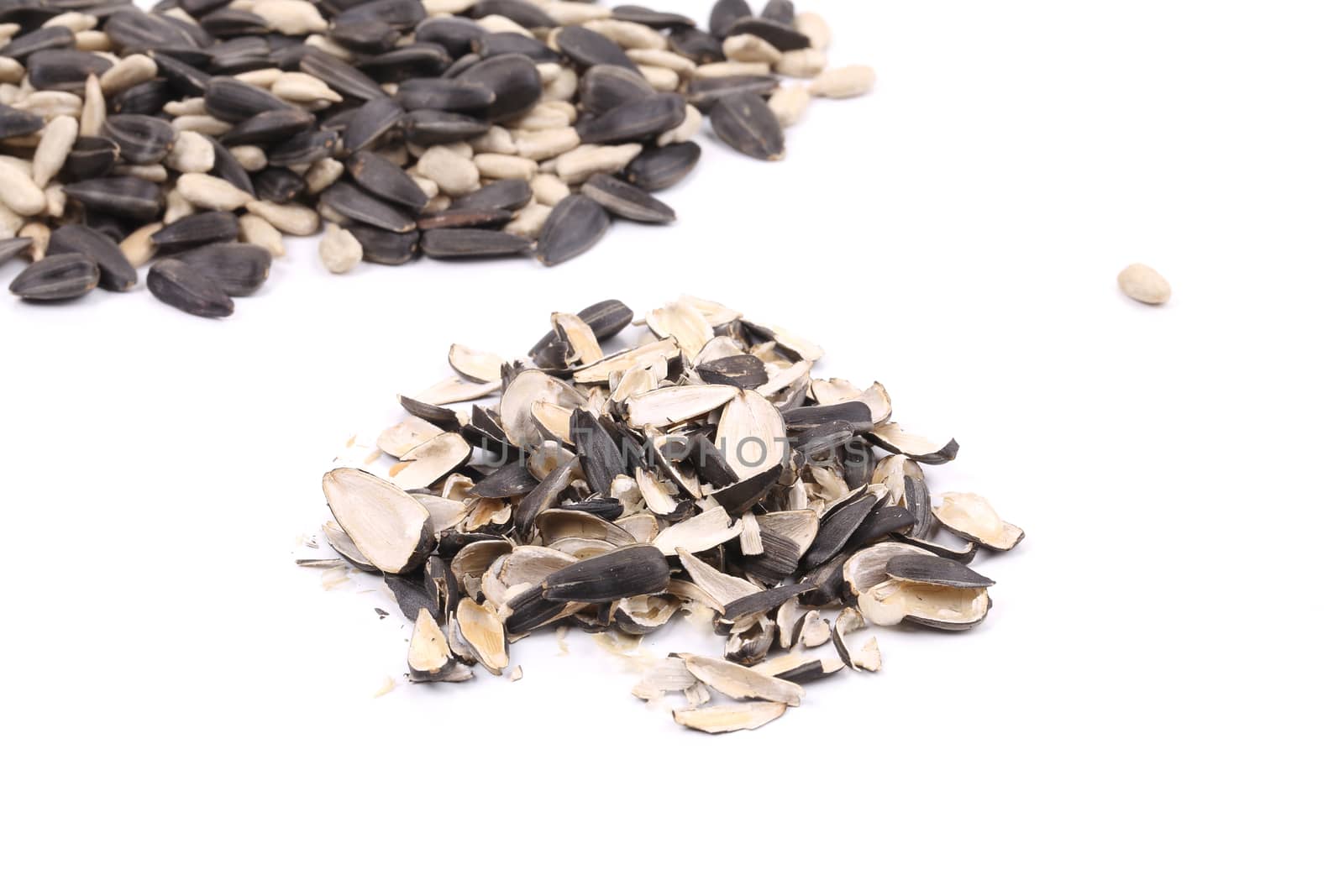 Heap of sunflower peels. Isolated on a white background.