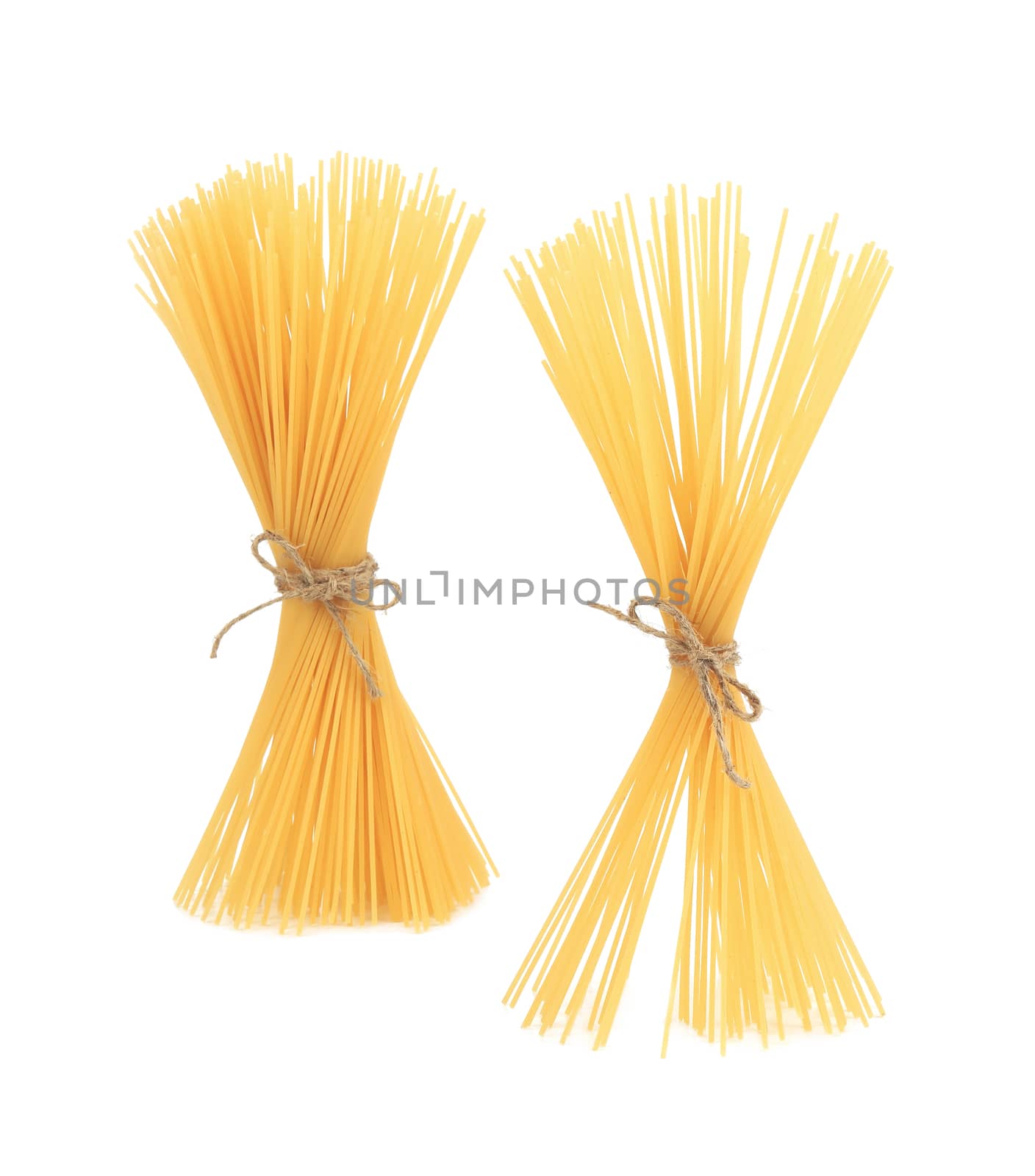 Raw spaghetti pasta. Isolated on a white background.
