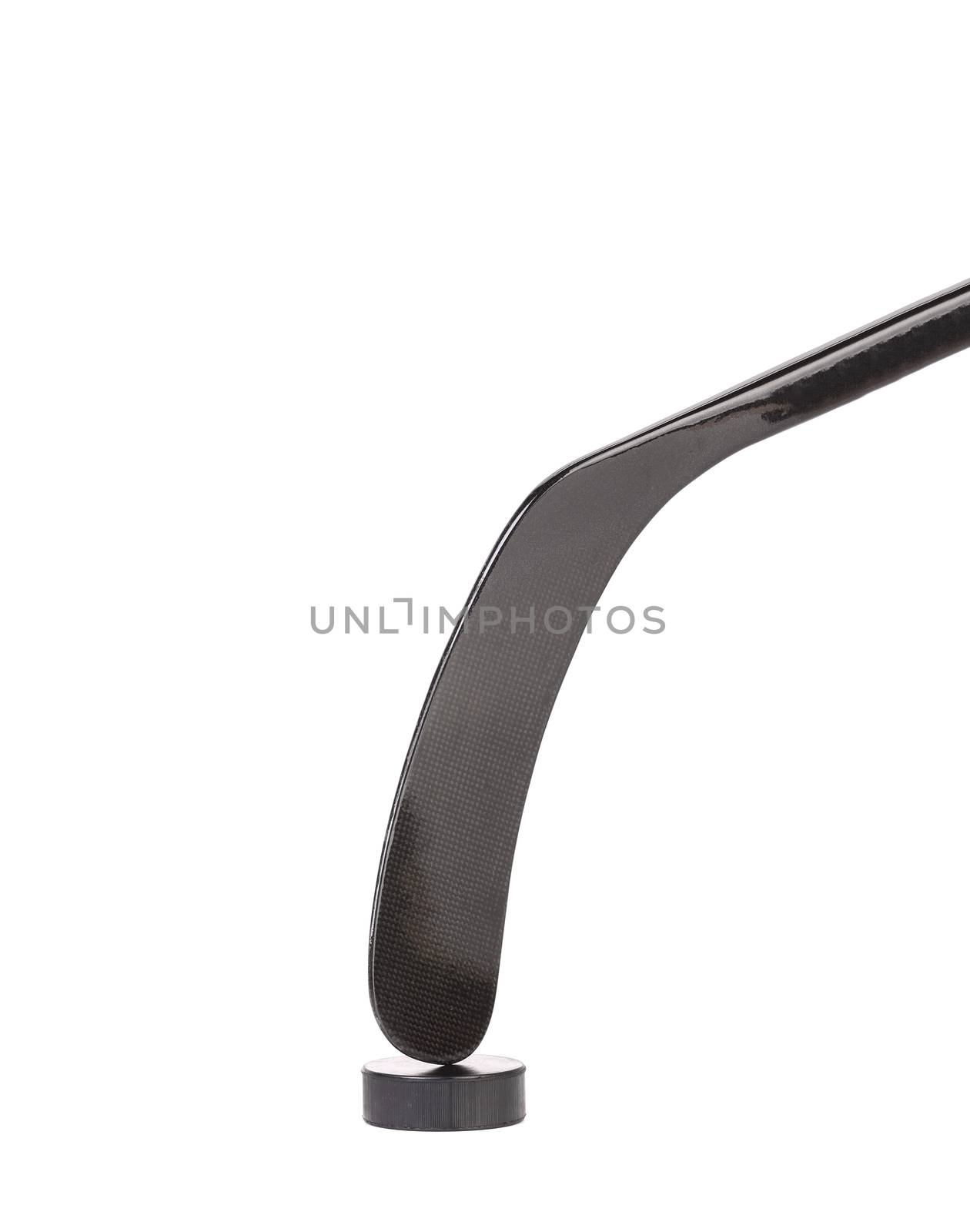 Black ice hockey stick and puck. Isolated on a white background.