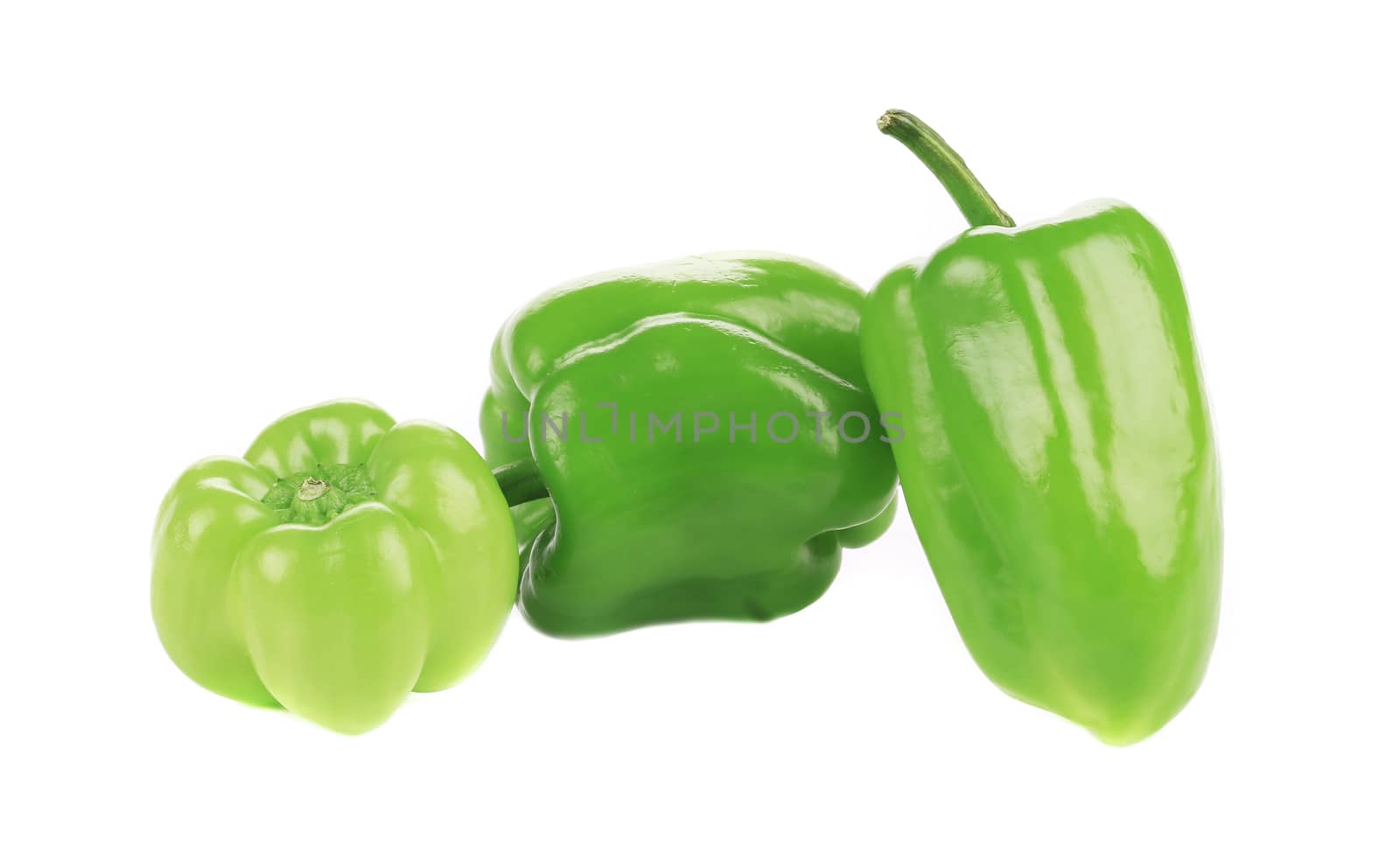 Three sweet green peppers. Isolated on a white background.