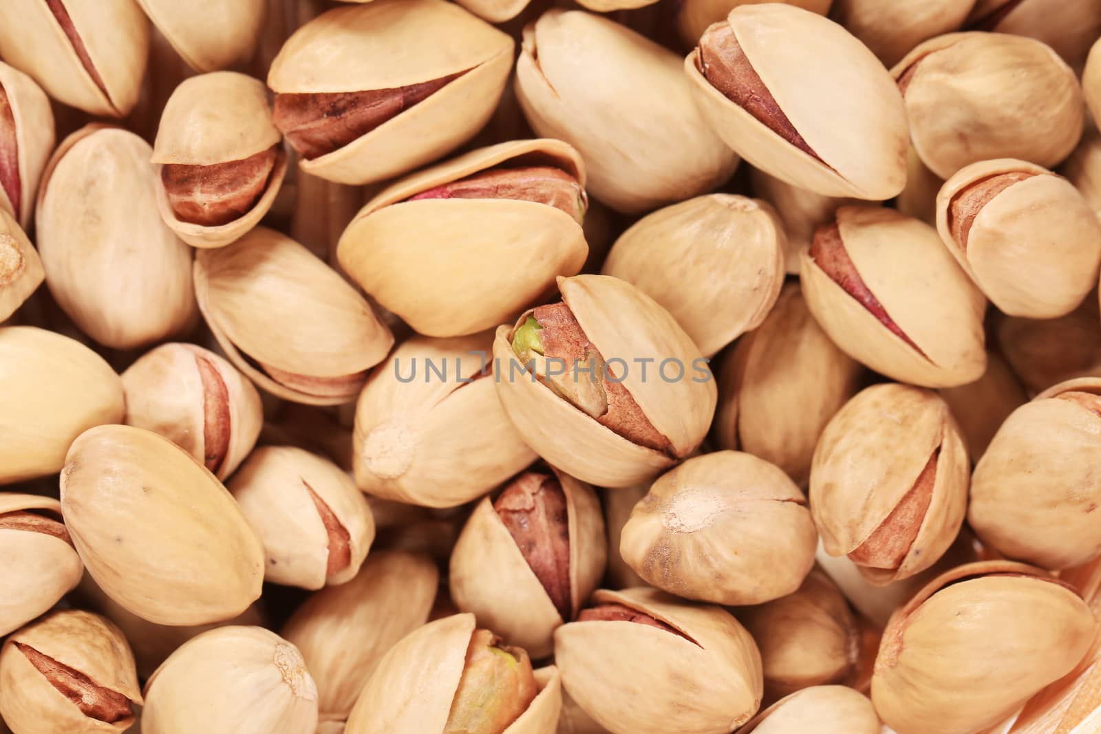 Close up of fresh pistachios. Whole background.