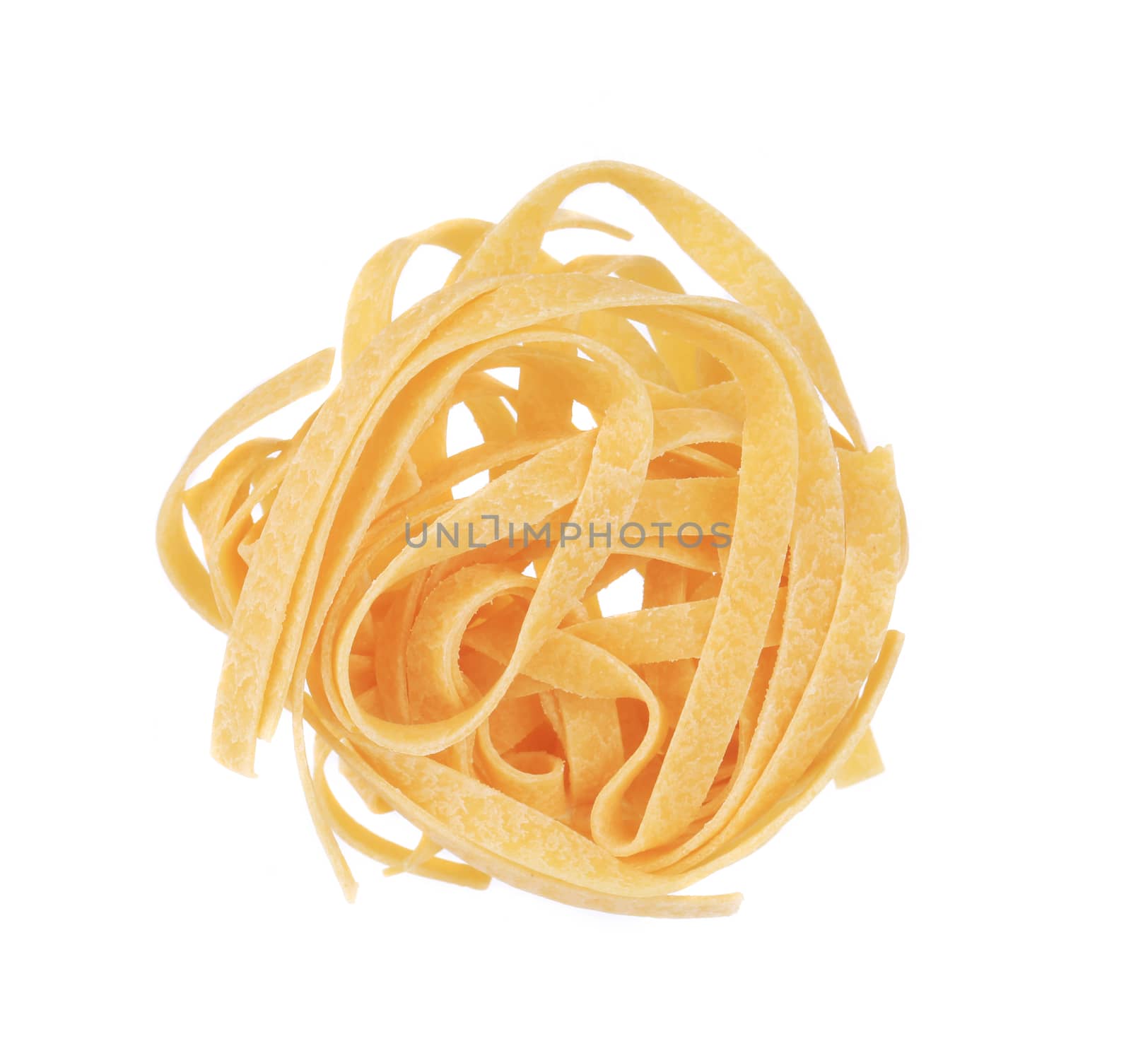 Raw italian pasta tagliatelle. Isolated on a white background.