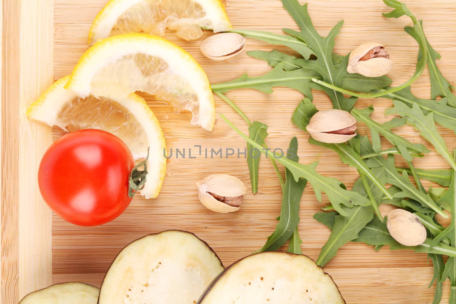 Vegetables on wooden board.  To be used as background.
